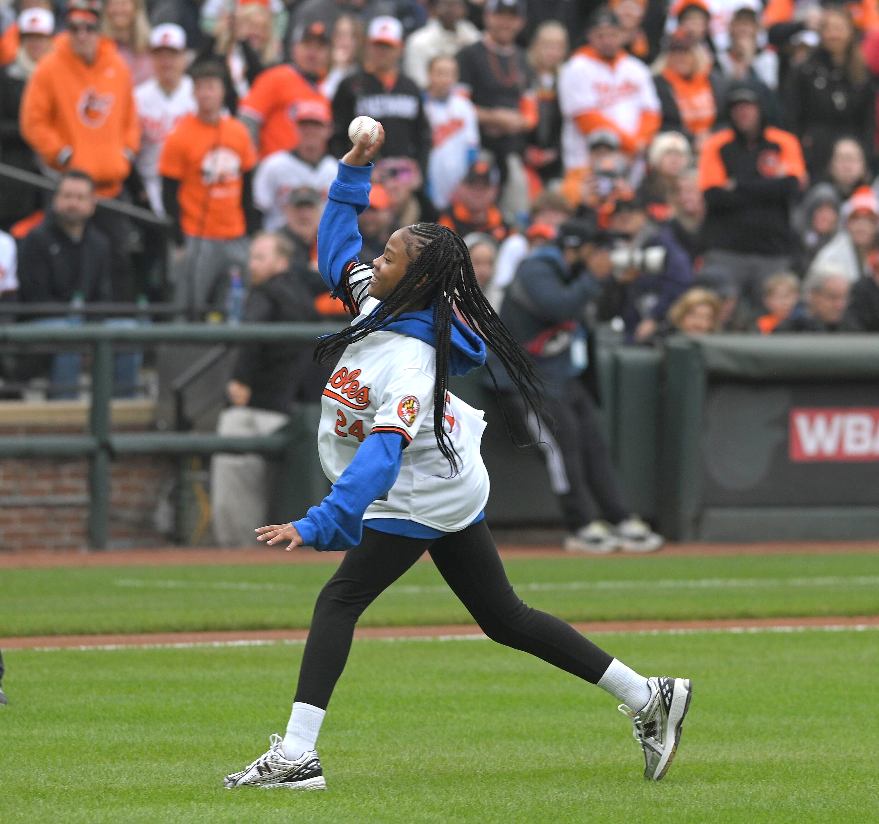 March 28, 2024: Aubree Singletary, 10 of Baltimore throws the ceremonial first pitch on opening day at Camden Yards (Kenneth K. Lam/Staff)