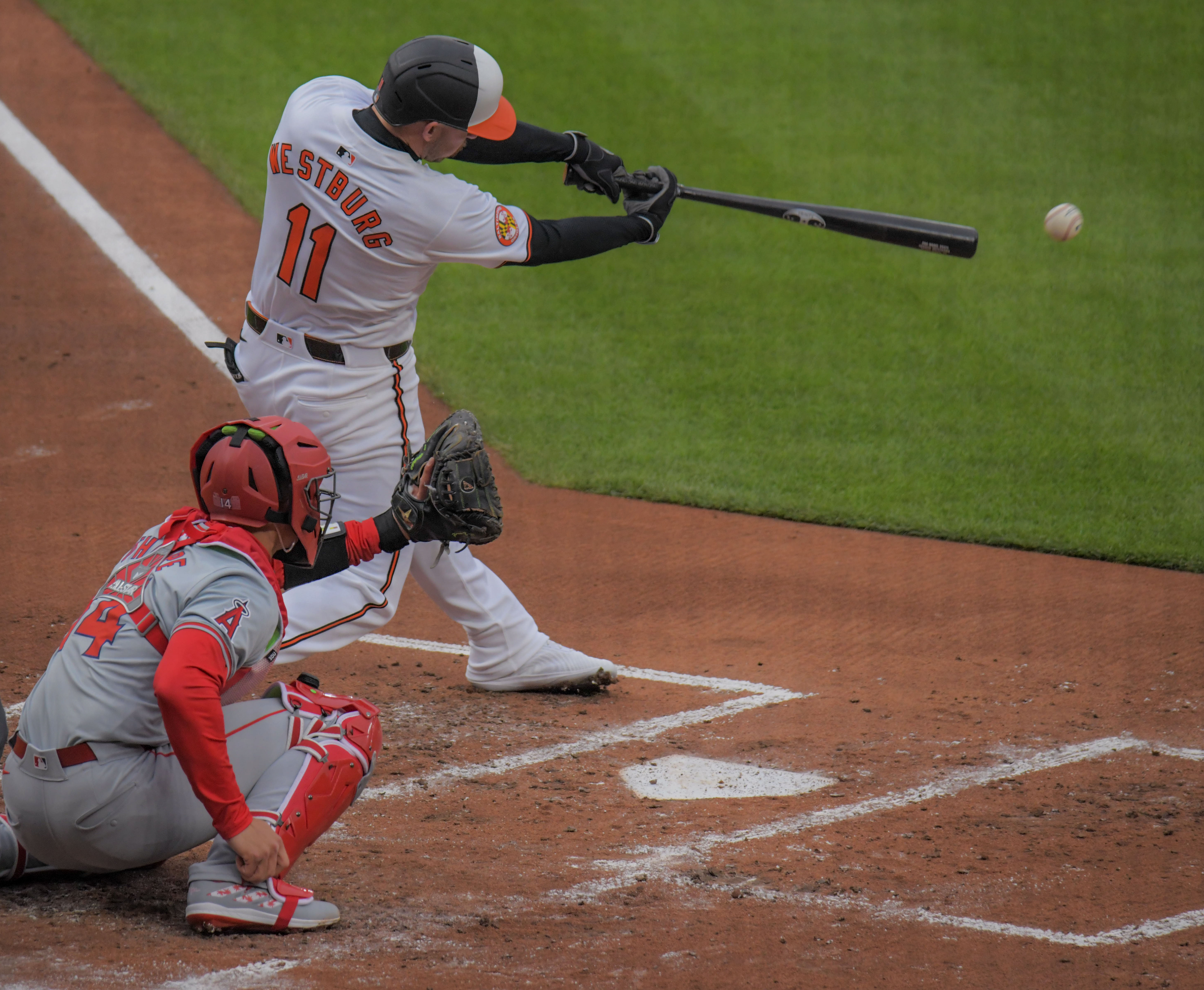 Mar 28, 2024: Baltimore Orioles batter Jordan Westburg drives an RBI single during a two-run first inning against the Los Angeles Angels on opening day of Major League Baseball at Oriole Park at Camden Yards. (Karl Merton Ferron/Staff)