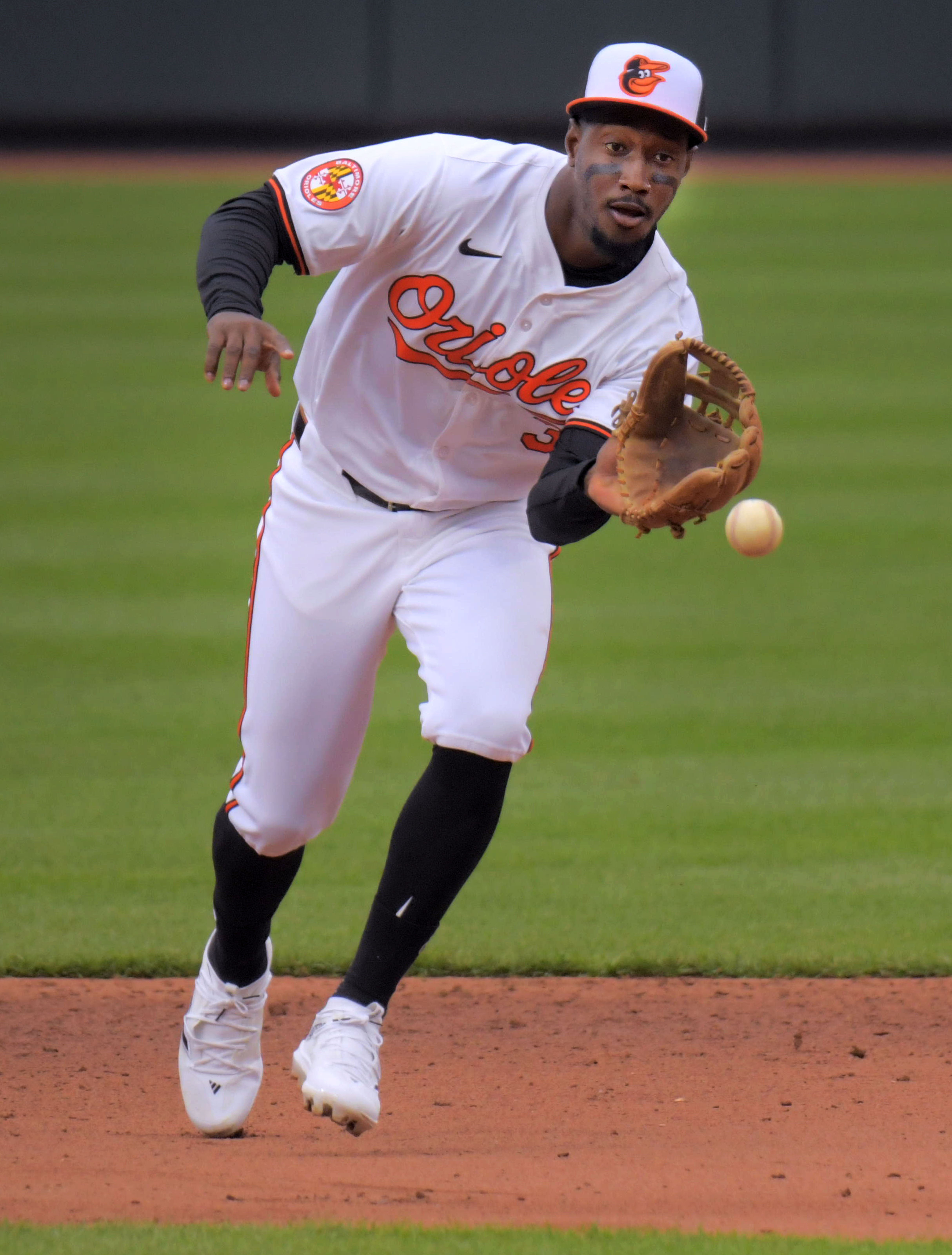 Mar 28, 2024: Baltimore Orioles second baseman Jorge Mateo fields a grounder by Los Angeles Angels batter Brandon Drury during opening day of Major League Baseball at Oriole Park at Camden Yards. (Karl Merton Ferron/Staff)