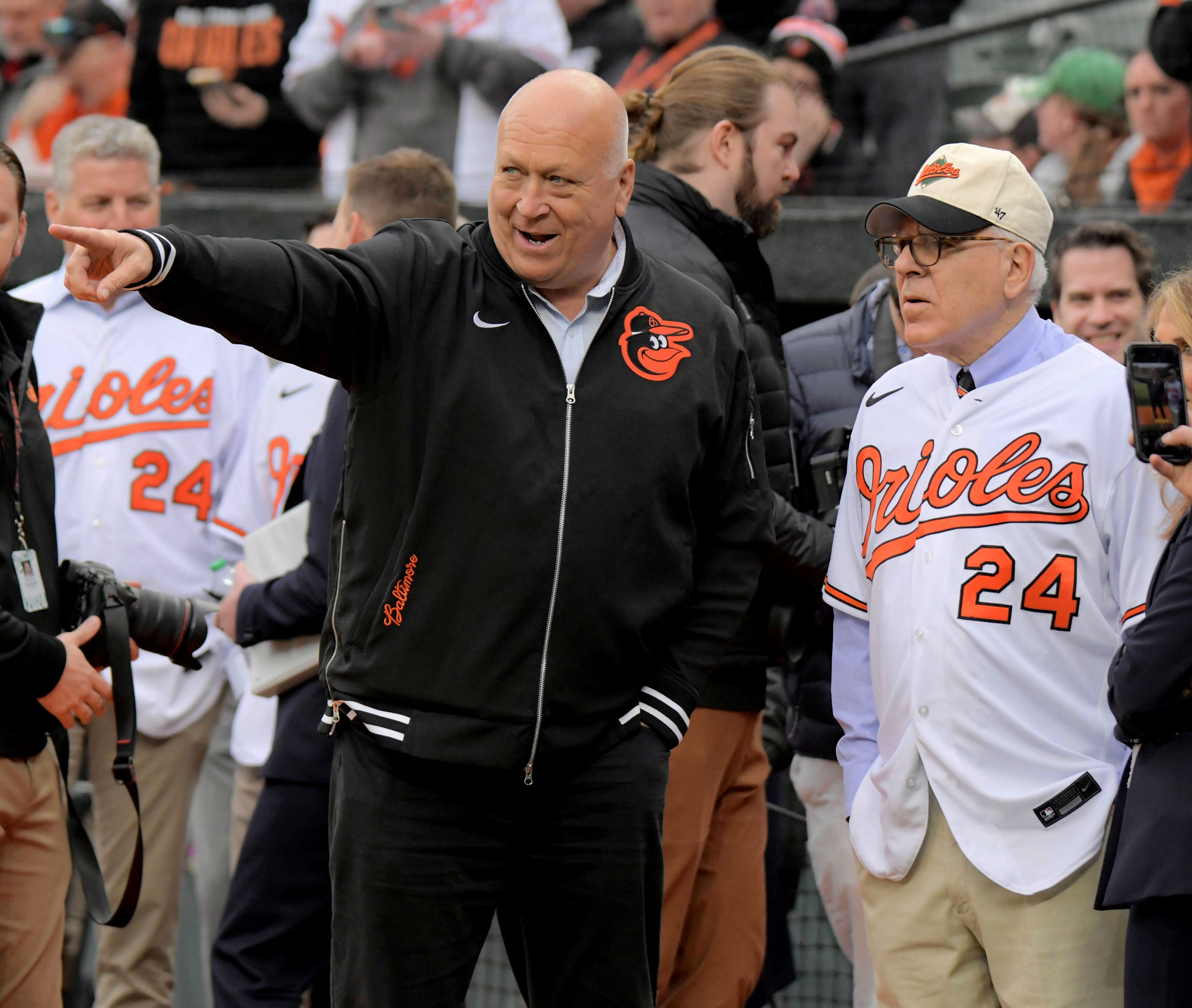 March 28, 2024: David Rubenstein, right, new owner of the Baltimore Orioles, with Cal Ripken Jr., part of the new owners group before opening day ceremonies begin. (Karl Merton Ferron)