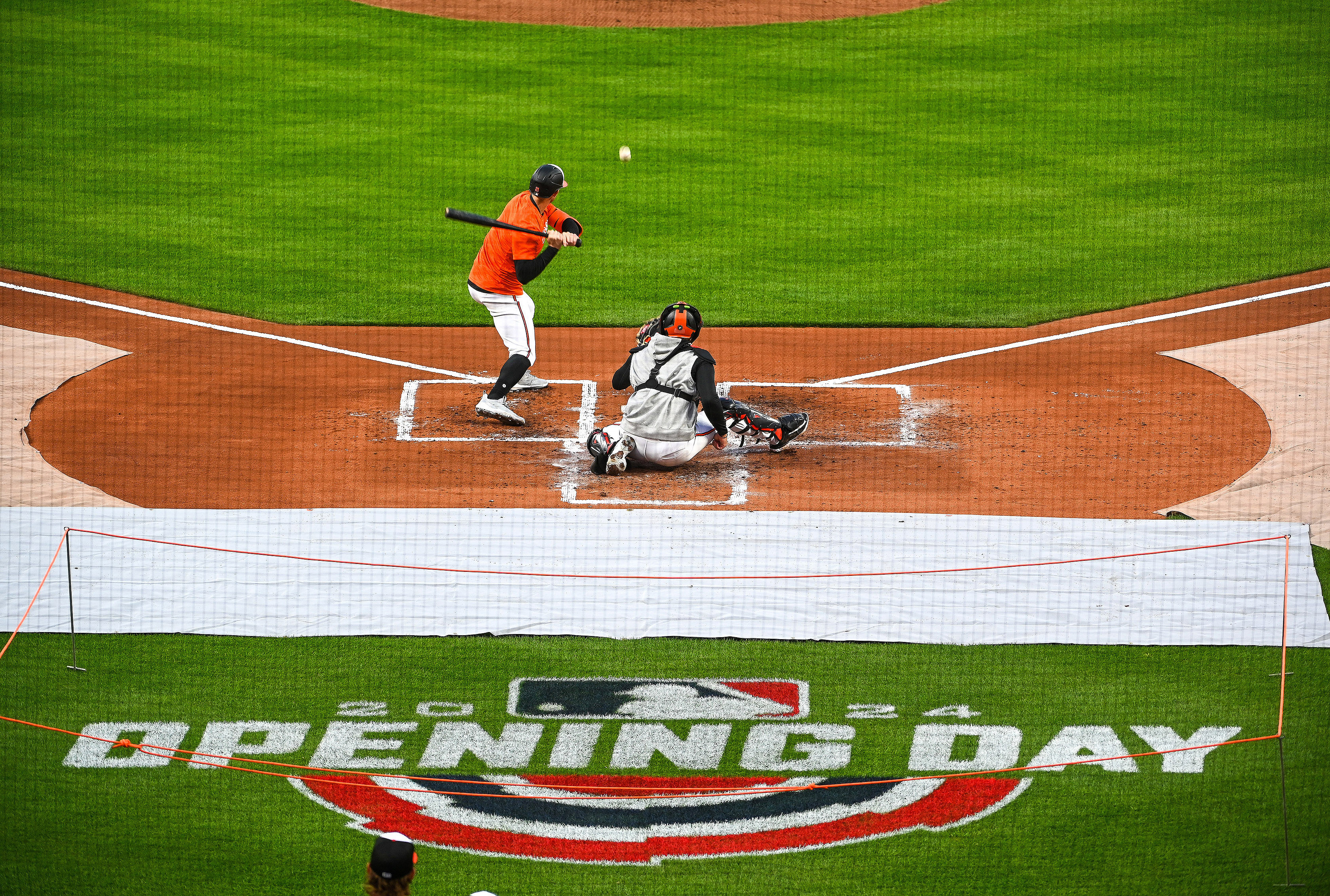 Mar. 26, 2024: Orioles held a workout at Camden Yards before their 2024 Opening Day game on Thursday against the Los Angeles Angels at Orioles Park. Orioles Austin Hays looks at a pitch from Dean Kremer (not shown) with catcher Adley Rutschman behind the plate. (Kevin Richardson/Staff)