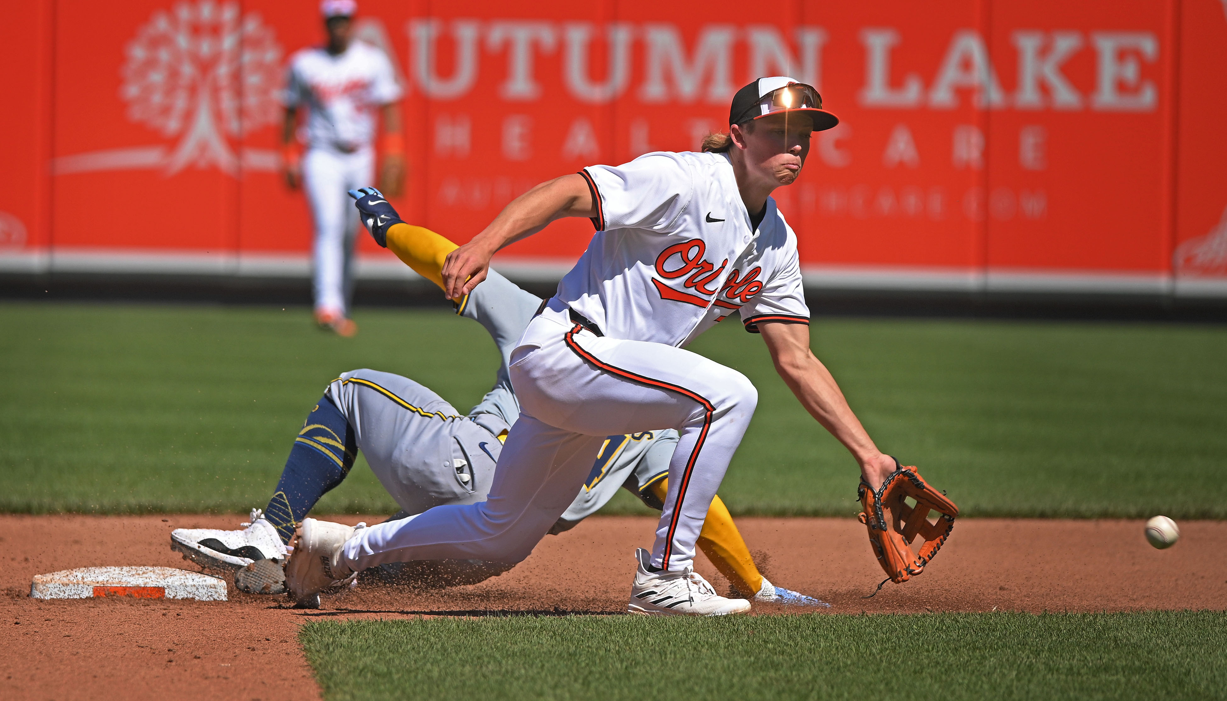 Brewers' William Contreras, left, steals second base as Orioles' Jackson Holliday awaits the throw in the fifth inning. The Orioles defeated the Brewers 6-4 at Oriole Park at Camden Yards. (Kenneth K. Lam/Staff)