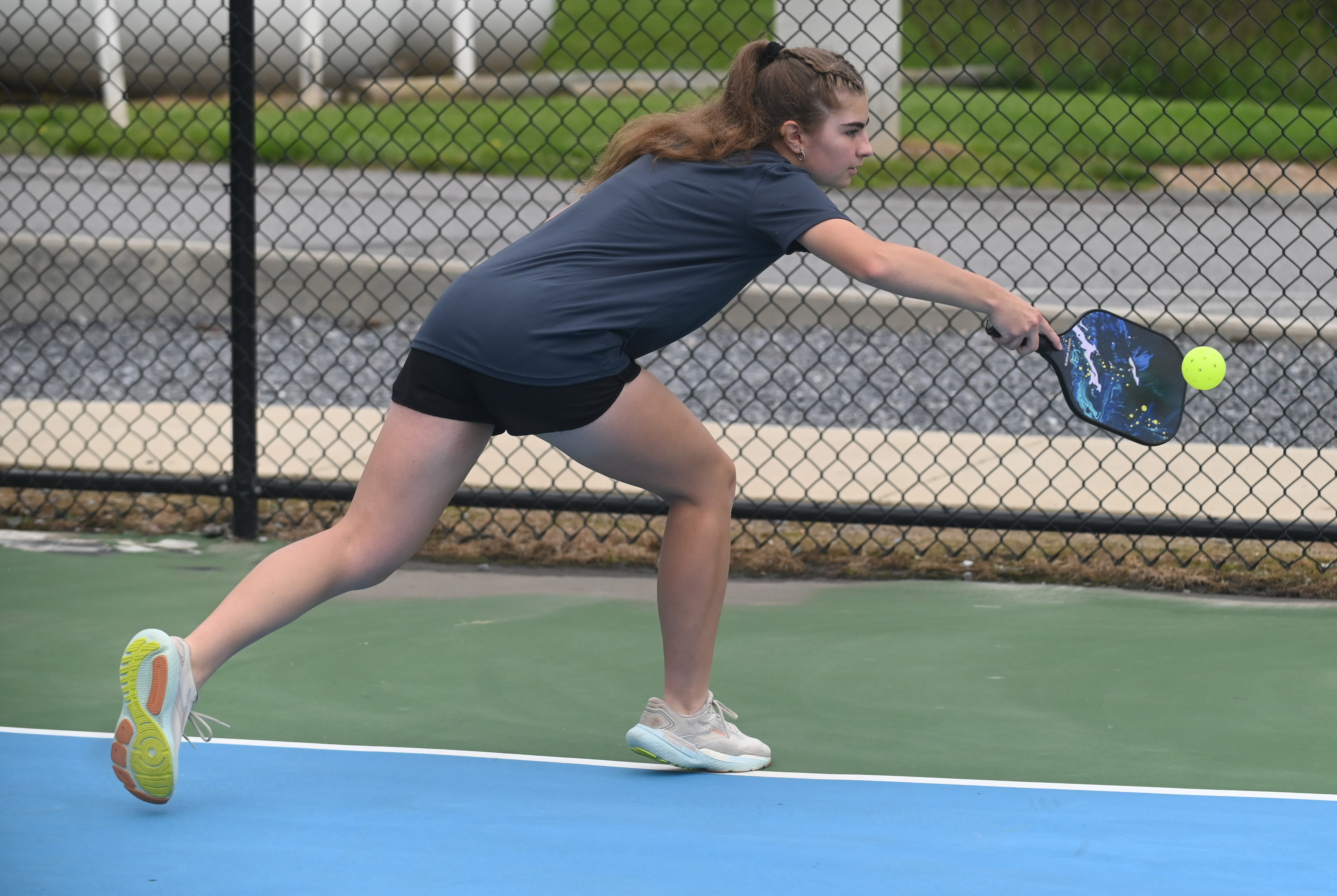 Jessica Grimm makes a playon the ball as she takes part in a pickleball tournament at Coppermine 4 Seasons on Tuesday. The tournament was organized by Manchester Valley High School juniors Brady Bonney and Leigh Hoke to raise money and support for Morgan's Message, a non-profit supporting student-athlete mental health initiatives. (Brian Krista/staff photo)