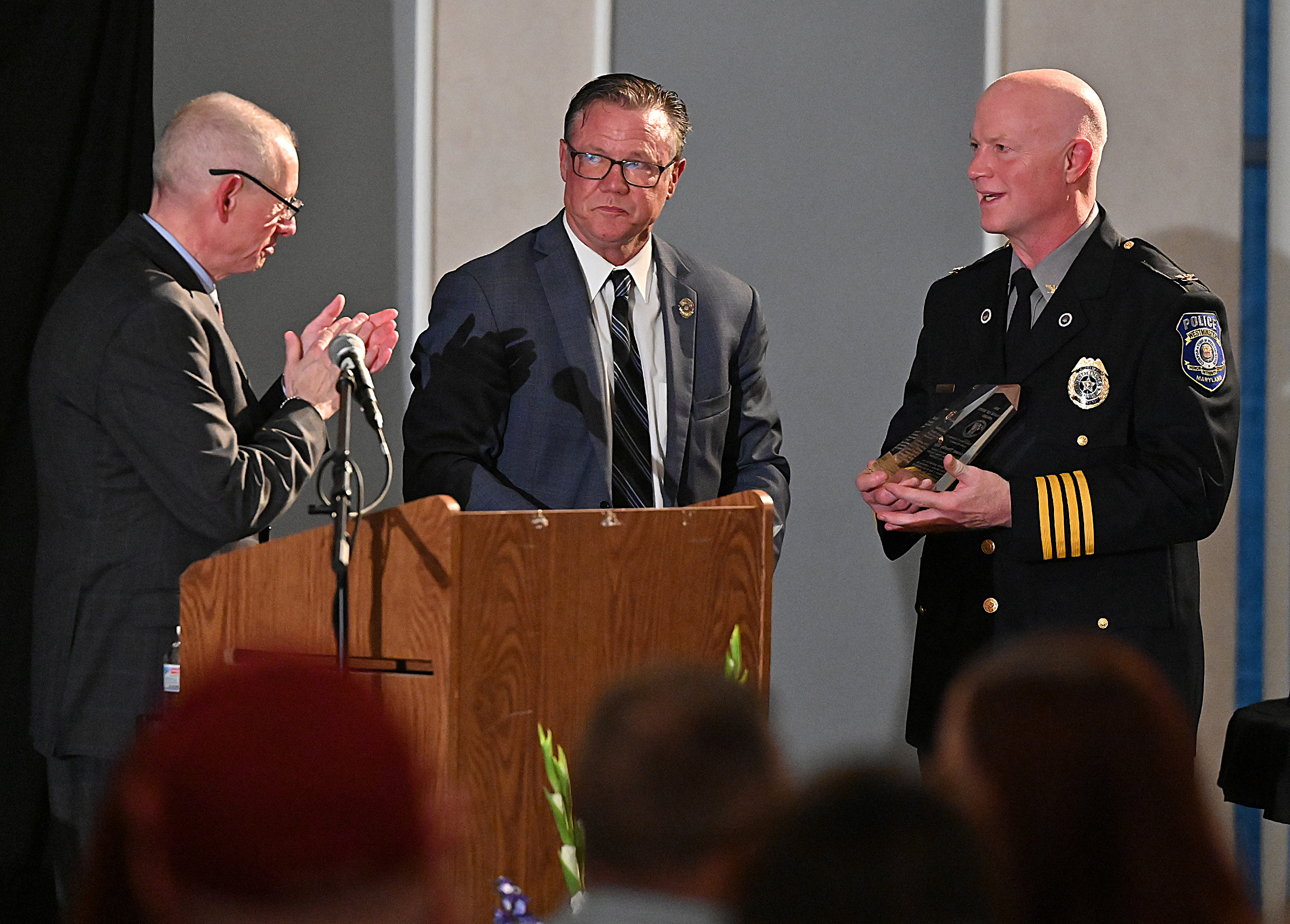 Westminster Chief Of Police, Thomas Ledwell, accepted the "Message of Hope Award" on behalf of Lt. Tim Rife at the 9th Annual Drug Overdose and Prevention Vigil Tuesday at Portico at St. John in Westminster. (Jeffrey F. Bill/Staff photo)