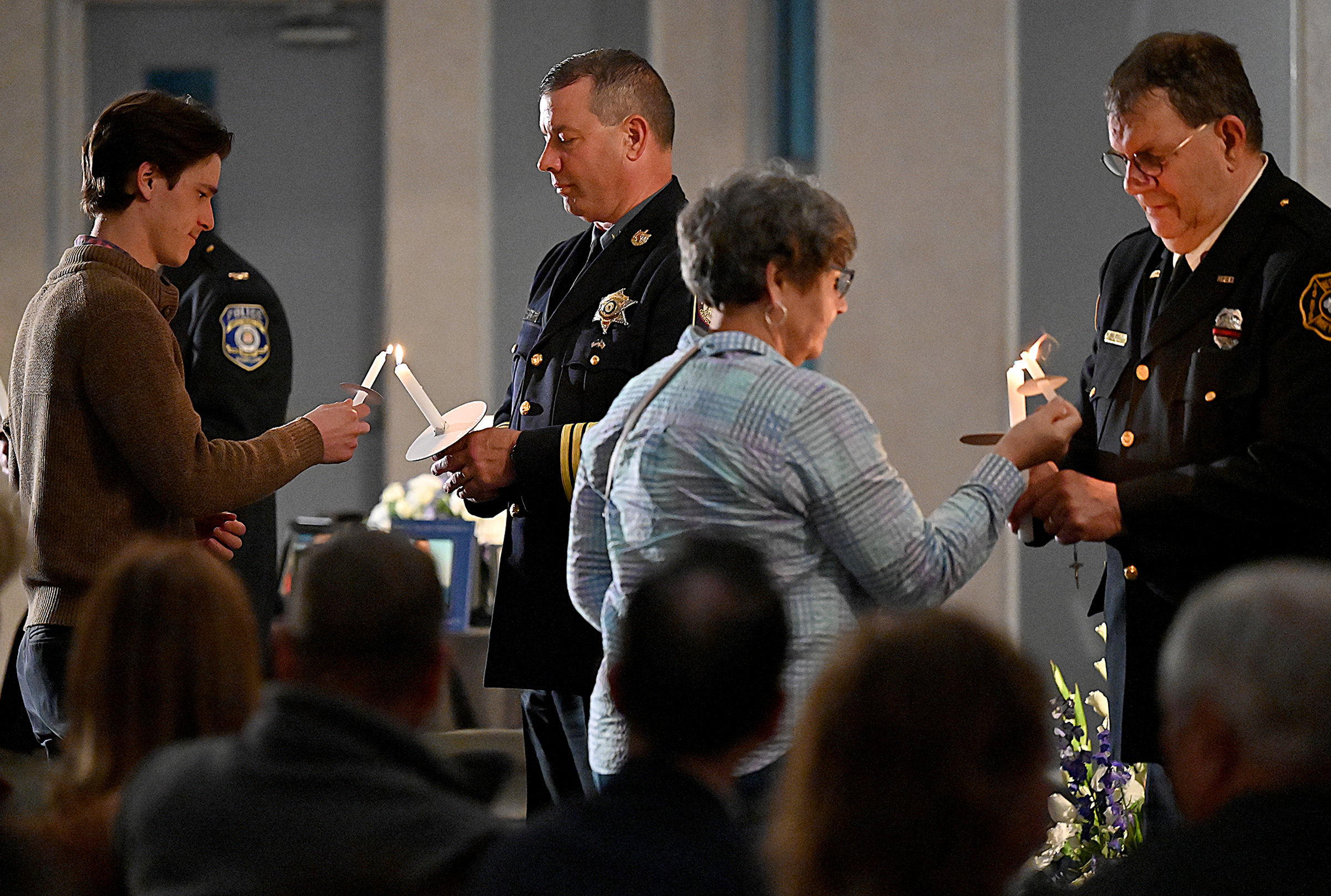 Carroll County Sheriff Jim DeWees and Westminster Common Councilmember Kevin E. Dayhoff, light candles for those remembering friends and loved ones lost to drug overdose at the 9th Annual Drug Overdose and Prevention Vigil Tuesday at Portico at St. John in Westminster. (Jeffrey F. Bill/Staff photo)