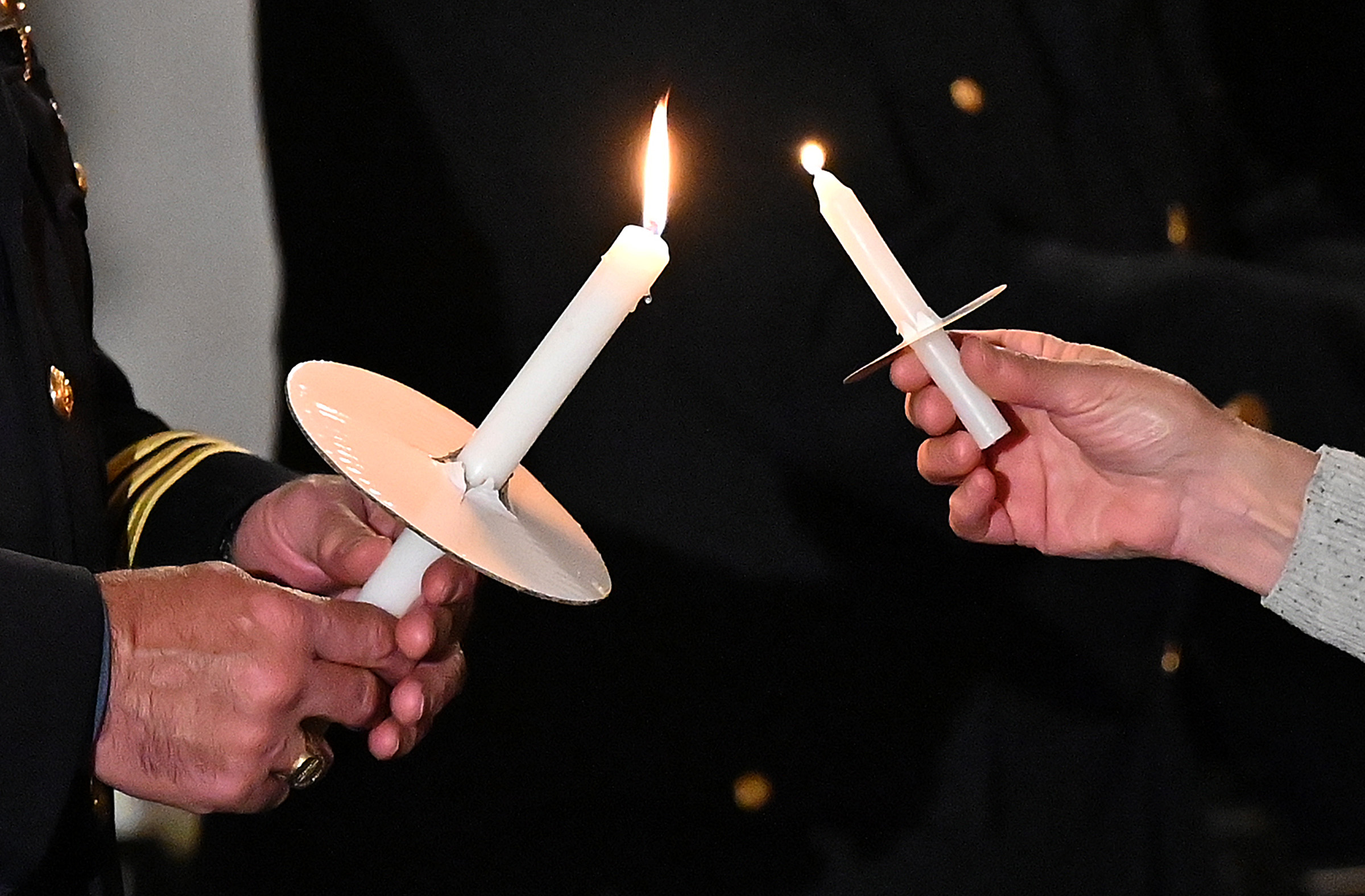 Candles are lit for those remembering friends and loved ones lost to drug overdose at the 9th Annual Drug Overdose and Prevention Vigil Tuesday at Portico at St. John in Westminster. (Jeffrey F. Bill/Staff photo)