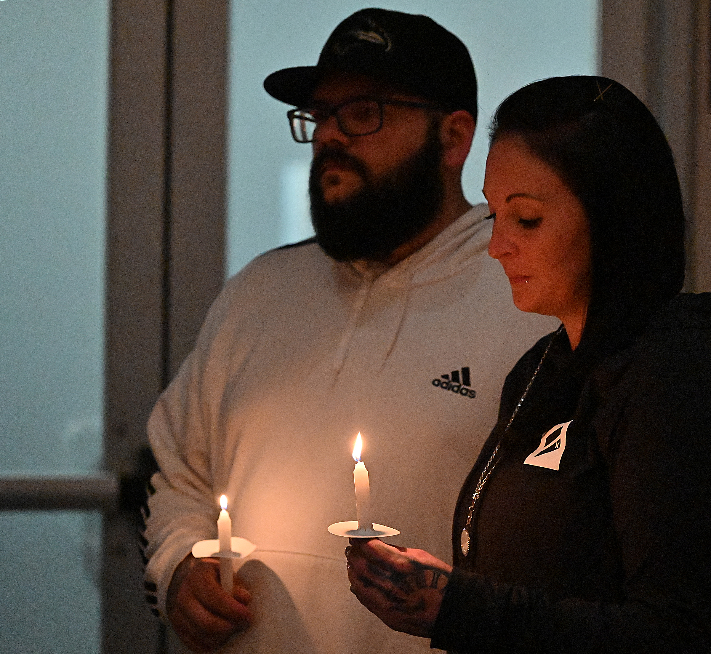 Friends and loved ones who lost someone to drug overdose, light candles in their memory at the 9th Annual Drug Overdose and Prevention Vigil Tuesday at Portico at St. John in Westminster. (Jeffrey F. Bill/Staff photo)