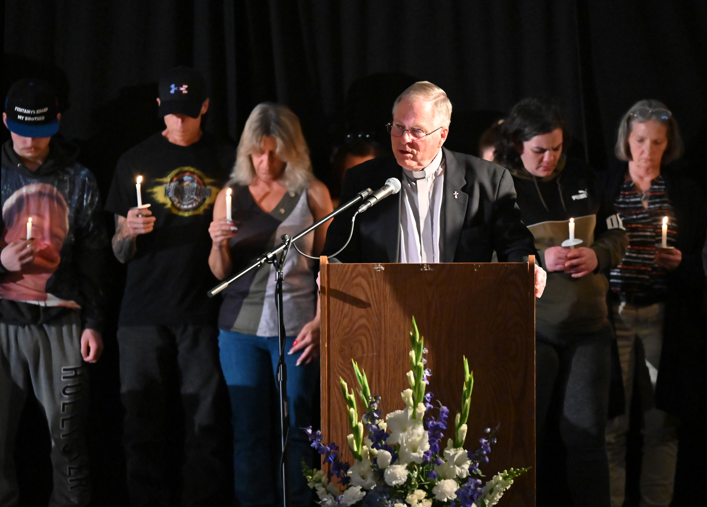 Deacon Steven Roscher gives the Benediction at the 9th Annual Drug Overdose and Prevention Vigil Tuesday at Portico at St. John in Westminster. (Jeffrey F. Bill/Staff photo)