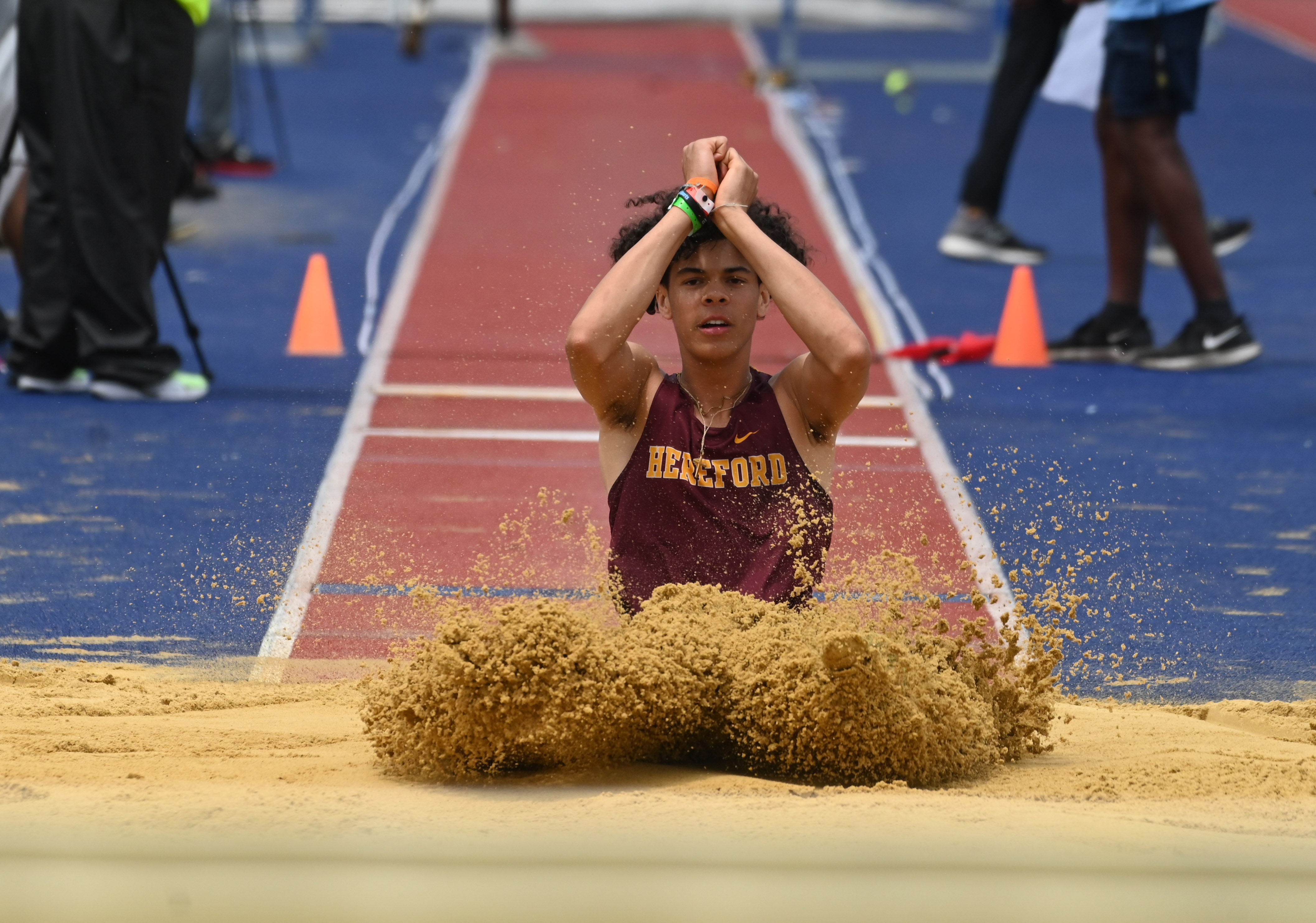 Hereford's Jadon Gaines competes in the 2A boys triple jump during the MPSSAA Track and Field State Championships at Prince George's Sports and Learning Complex on Thursday. (Brian Krista/staff photo)