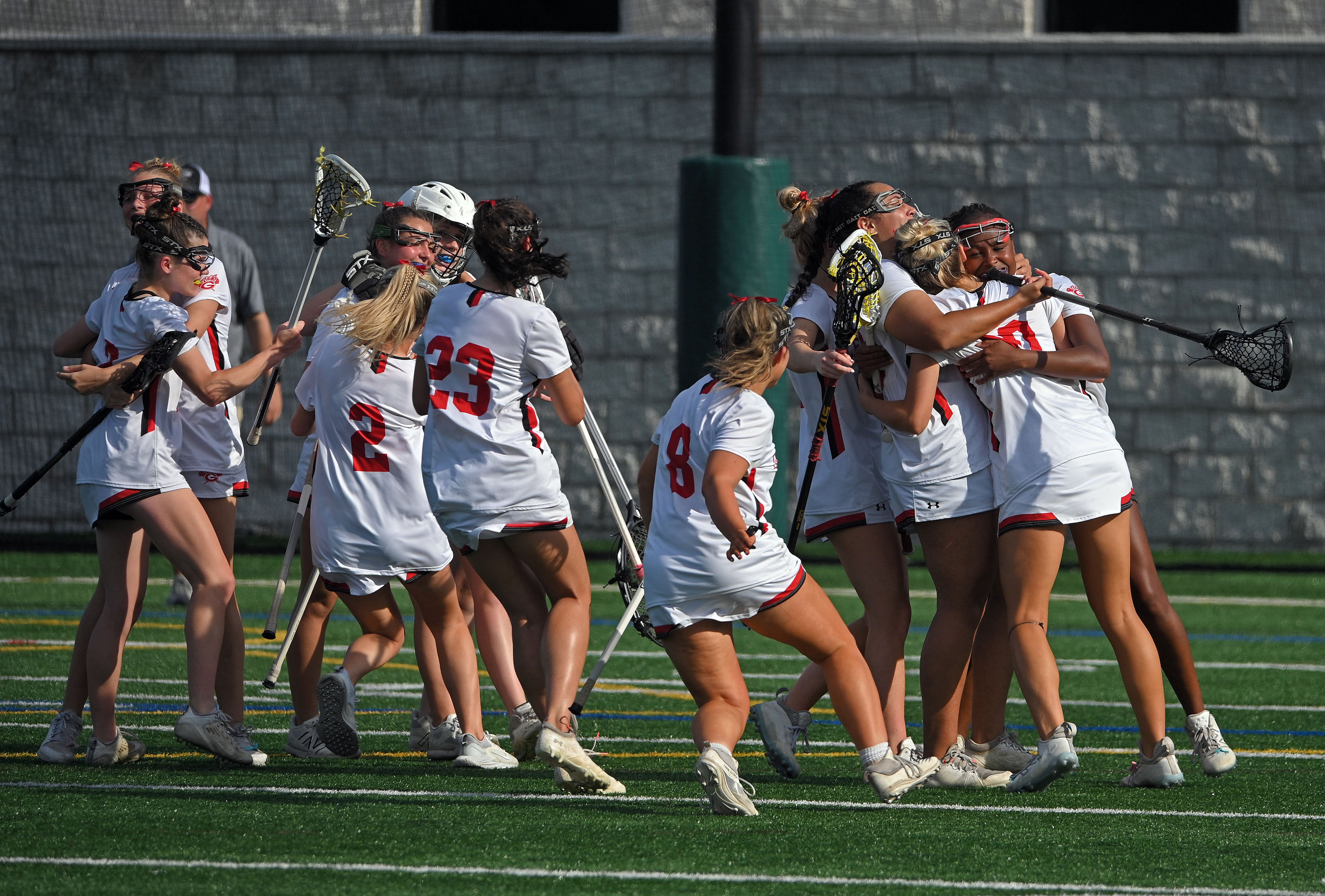 Glenelg players celebrate after defeating Queen Anne's 13-3 to win Class 2A state girls lacrosse championship at Stevenson University. (Kenneth K. Lam/Staff)