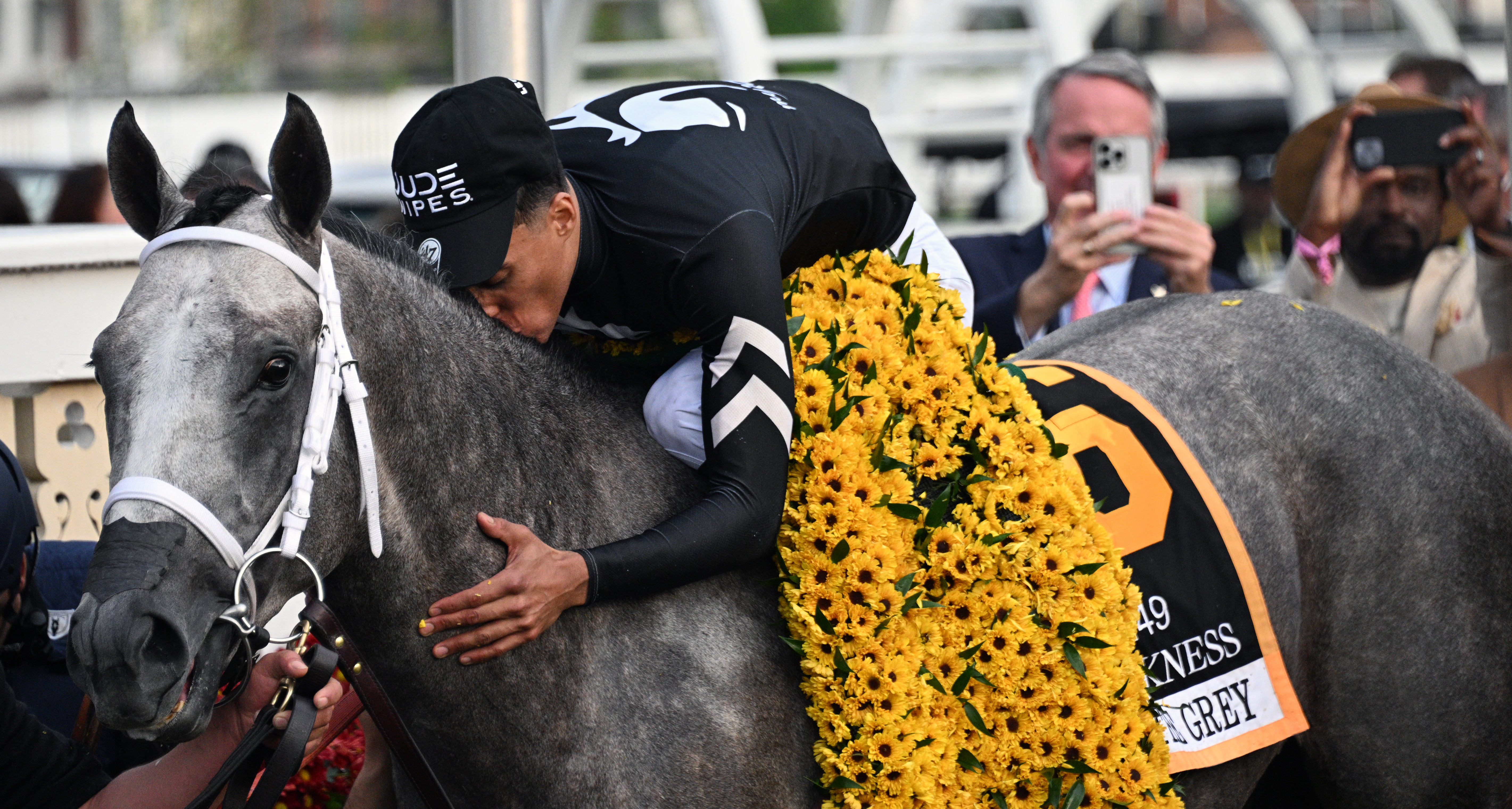 Jockey Jaime Torres kisses Seize the Grey in the winner's circle. (Kim Hairston/Staff)