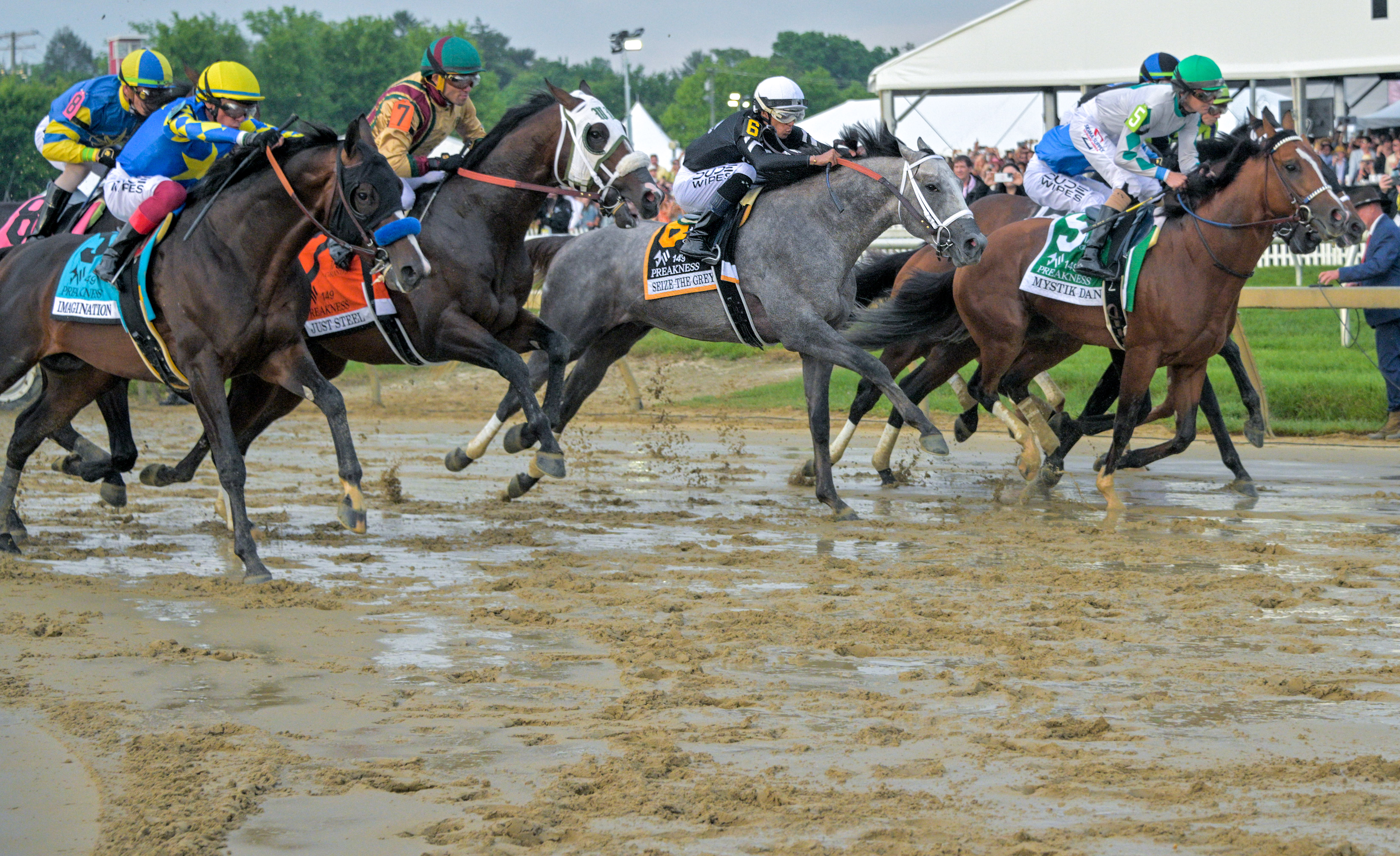 Jockey Jaime Torres, riding Seize the Grey, center charges out of the starting gate with the field of eight horses during the 149th running of the Preakness Stakes at Pimlico Race Course. (Karl Merton Ferron/Staff)