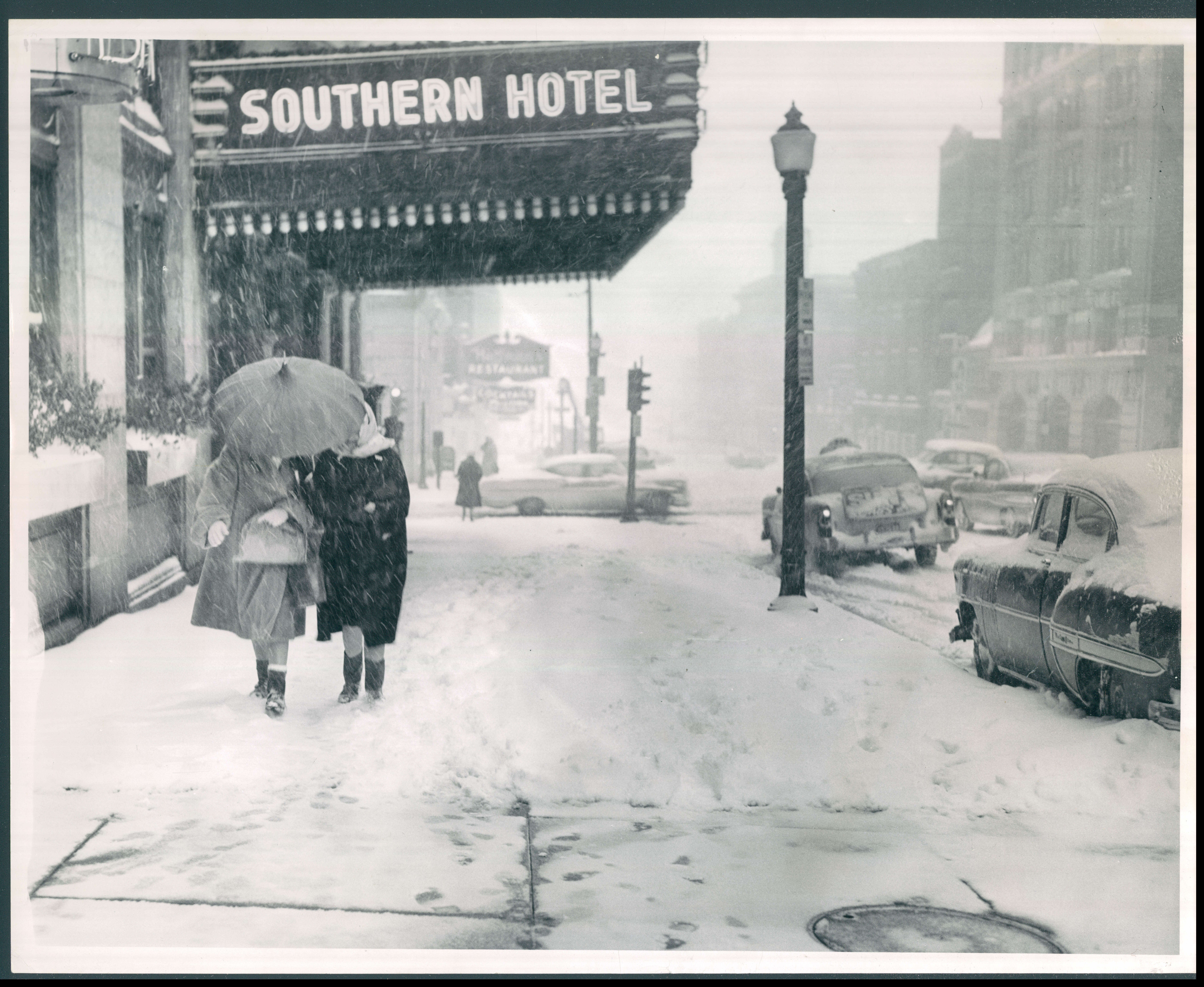 March 3, 1960 - SNOW STORM -- Fine snowflakes blur the quiet, sparsely populated downtown scene in a 9-inch snowstorm, the cityâ€™s most severe snowfall of the year. Photo by Walter M. McCardell BIW-579-BSDate Created: 1960-03-05 Copyright Notice: Baltimore Sun Folder Description: Baltimore Weather Snow Folder Extended Description: 3/3/1960 | 589-11B | Oversized | Title: WEATHER SNOW BALTIMORE MARCH 3, 1960 Subject: WEATHER SNOW BALTIMORE