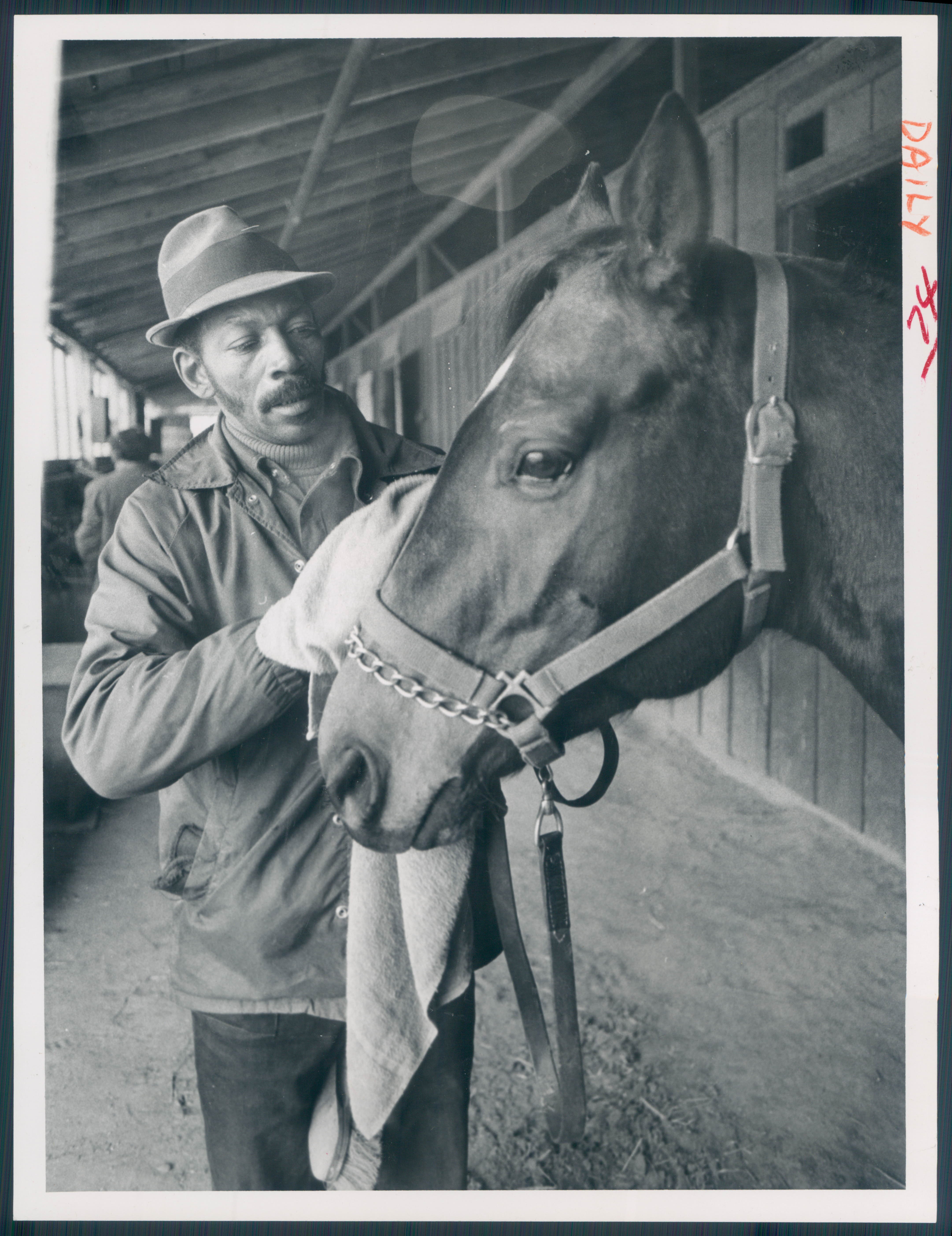 January 8, 1976 - Chester Moore and one of his horses, San Sunset. Photo by Walter M. McCardell BOH-624-BSDate Created: 1976-01-08 Copyright Notice: Baltimore Sun Folder Description: Moore, Chester Folder Extended Description: Moore, Chester Title: MOORE CHESTER Subject: MOORE