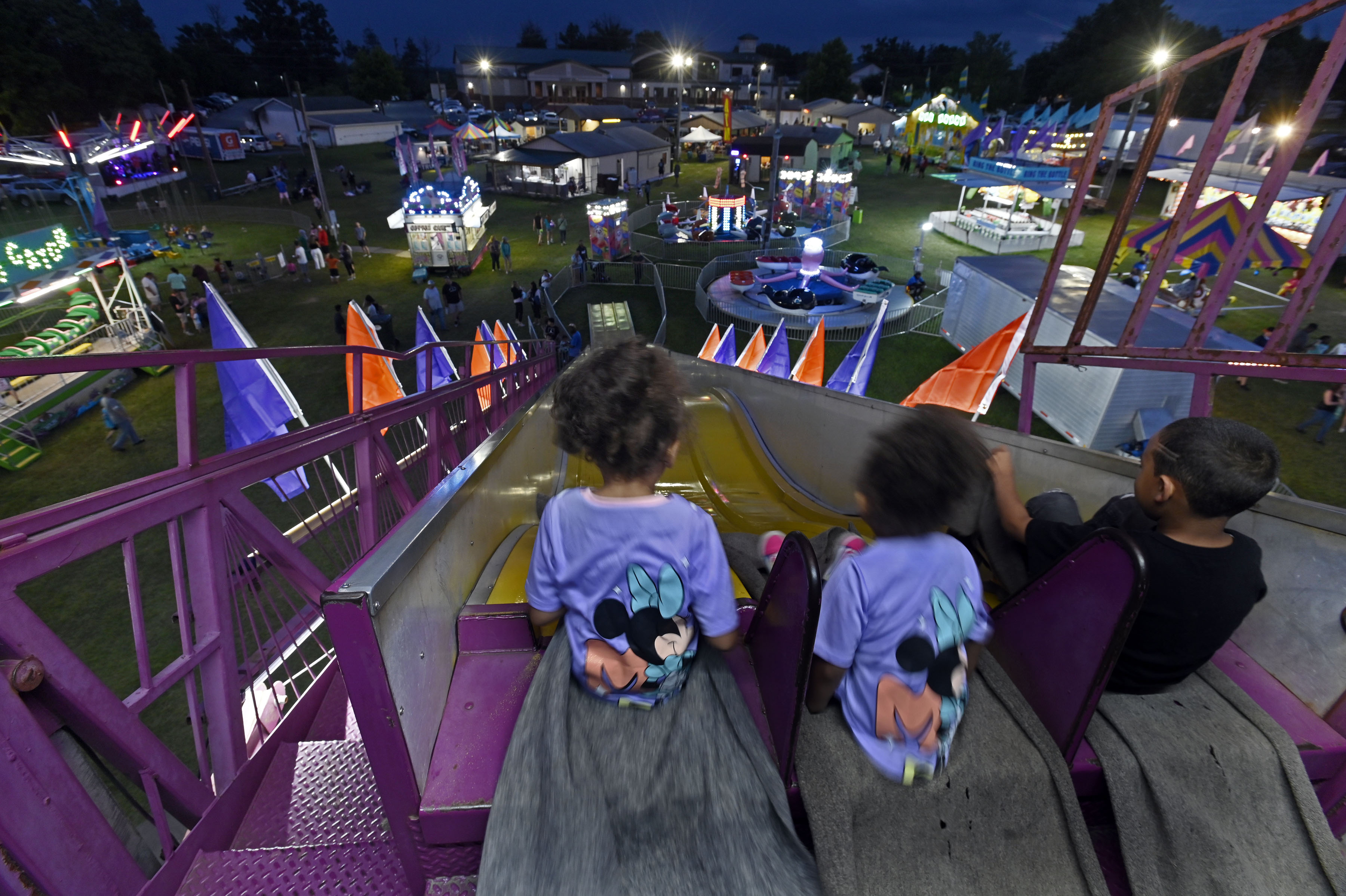 Children ride a giant slide at Sykesville Freedom District Fire Department's Annual firemen's carnival which runs from June 8-15. (Kenneth K. Lam/Staff)