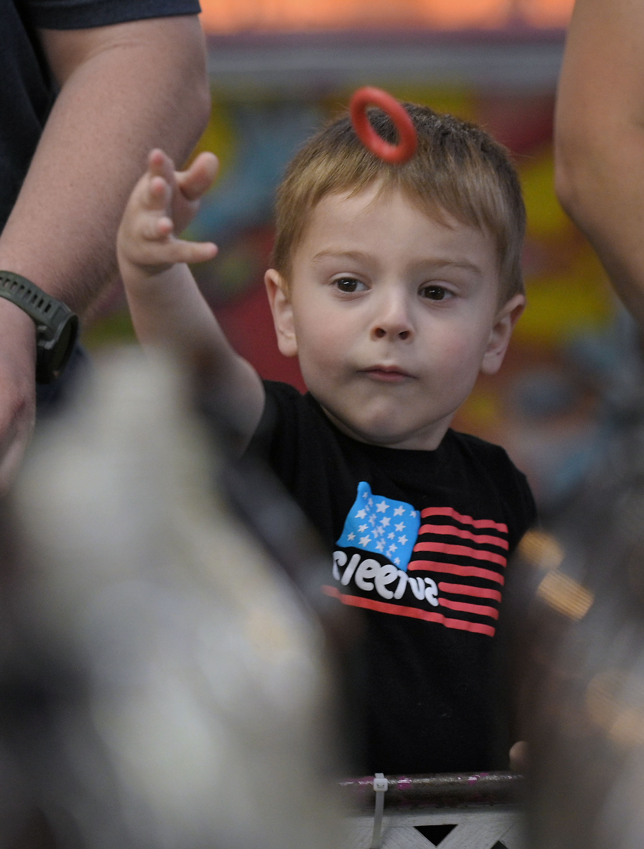 Jameson Yarnall, 4, of Sykesville, throws a small ring at large soda bottles during Sykesville Freedom District Fire Department's Annual firemen's carnival. The carnival runs from June 8-15. (Kenneth K. Lam/Staff)