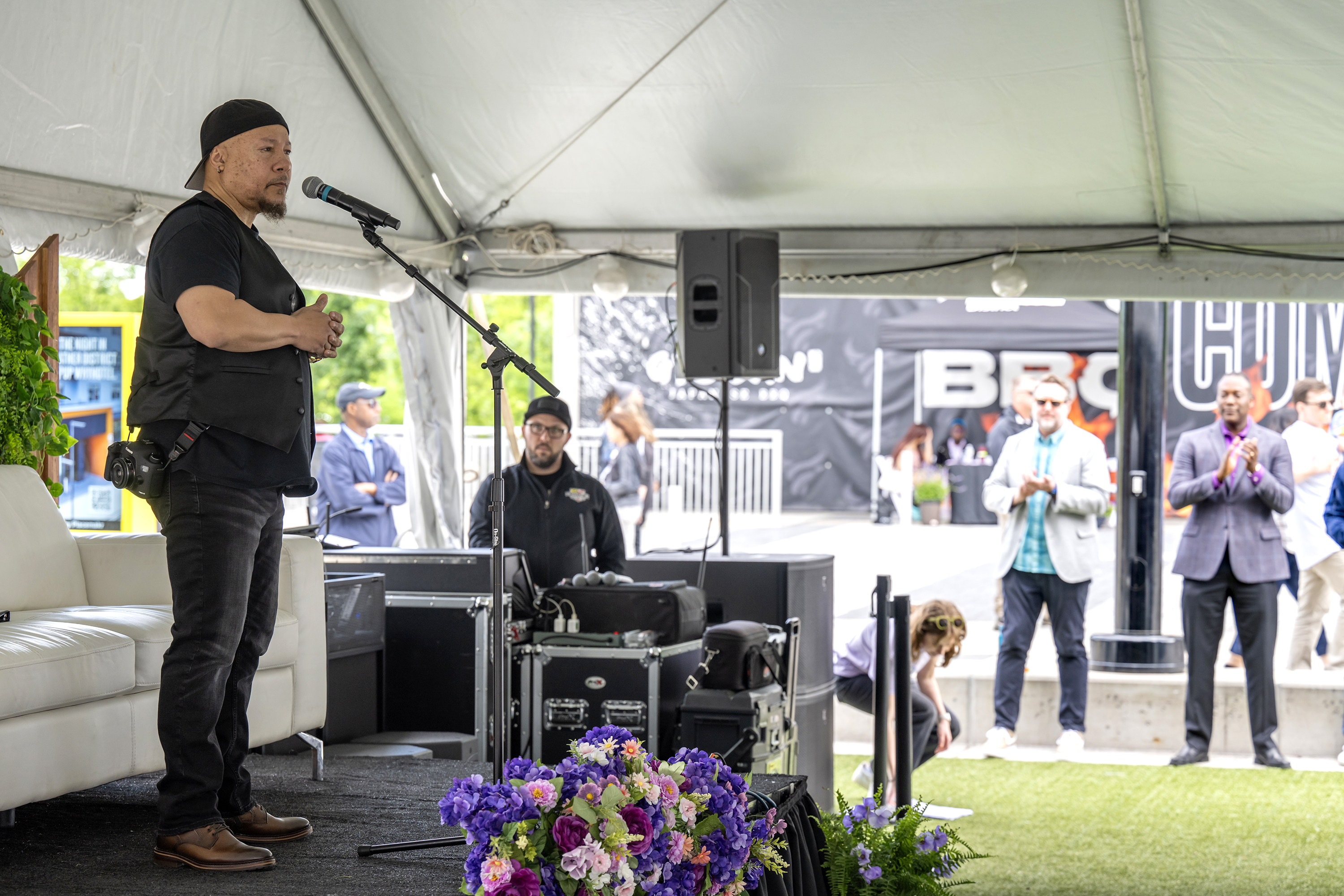 Howard County's inaugural poet laureate Truth Thomas reads at the annual Books in Bloom event in May.