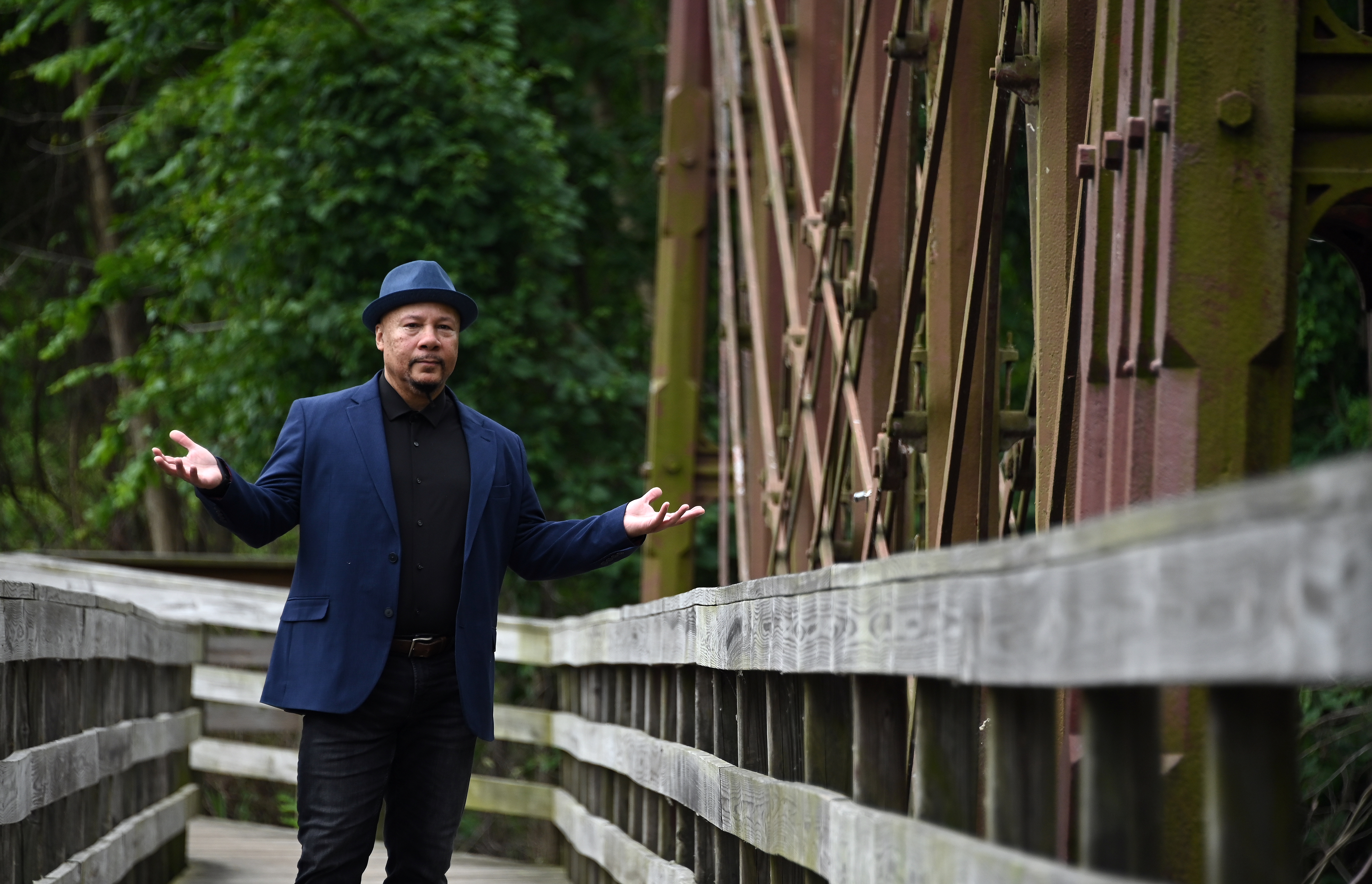June 4, 2024: Truth Thomas, the inaugural Howard County Poet Laureate, at the Bollman Iron Truss Bridge. Thomas ofter writes in the nearby Savage Mill. He will serve for two-years in the position, a partnership between Howard County Executive Calvin Ball, Howard County Arts Council and the Howard County Poetry and Literature Society. (Kim Hairston/Staff)