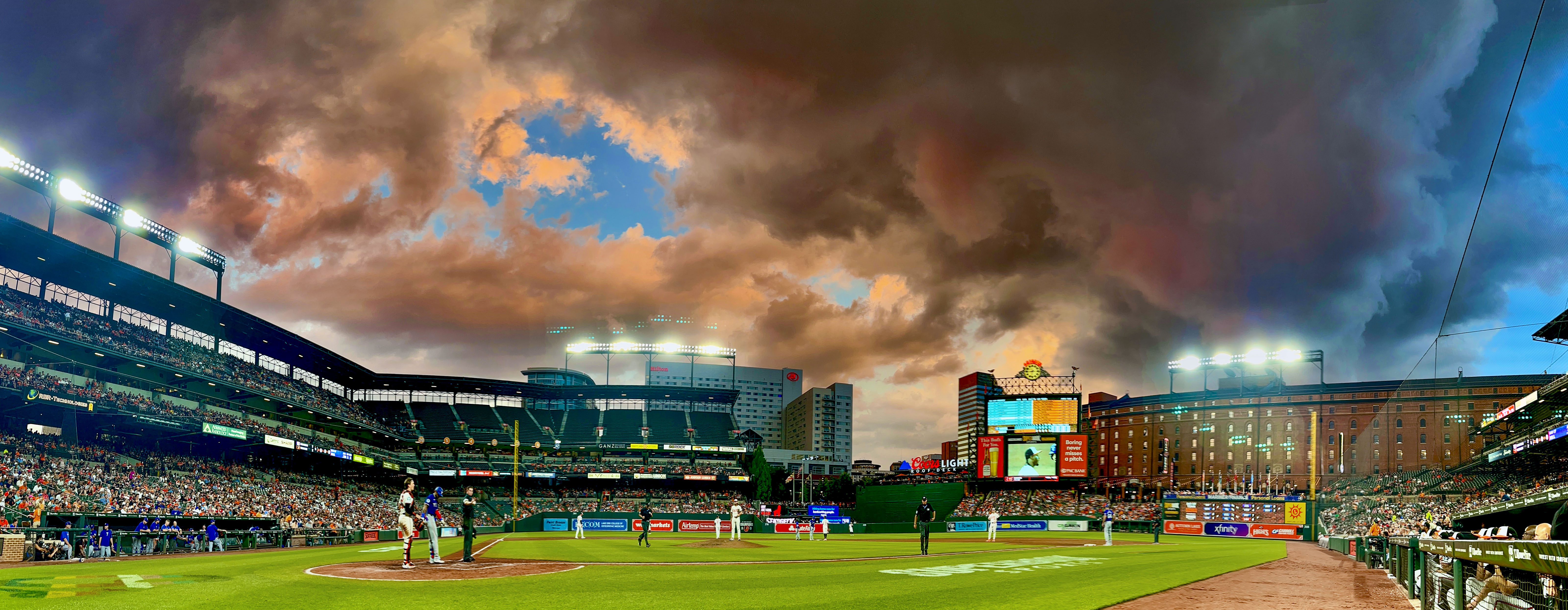 Evening clouds threaten but fail to produce any serious weather over the ballpark during major league baseball between the Baltimore Orioles and the Texas Rangers at Oriole Park at Camden Yards. (Karl Merton Ferron/Staff)