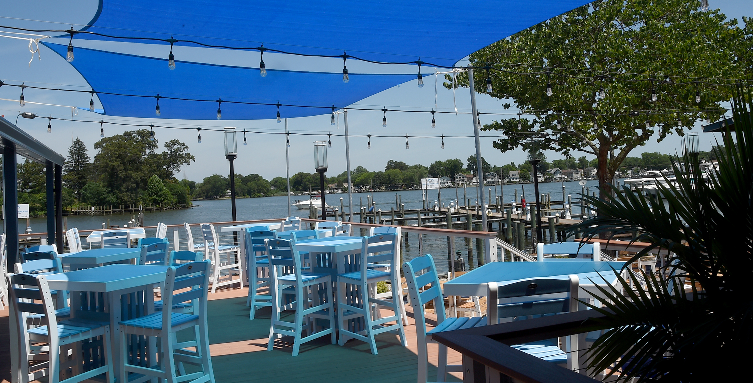 Several dining areas overlook Hopkins Creek at LoonAsea, a new waterfront restaurant/bar in Essex. (Barbara Haddock Taylor/Staff)