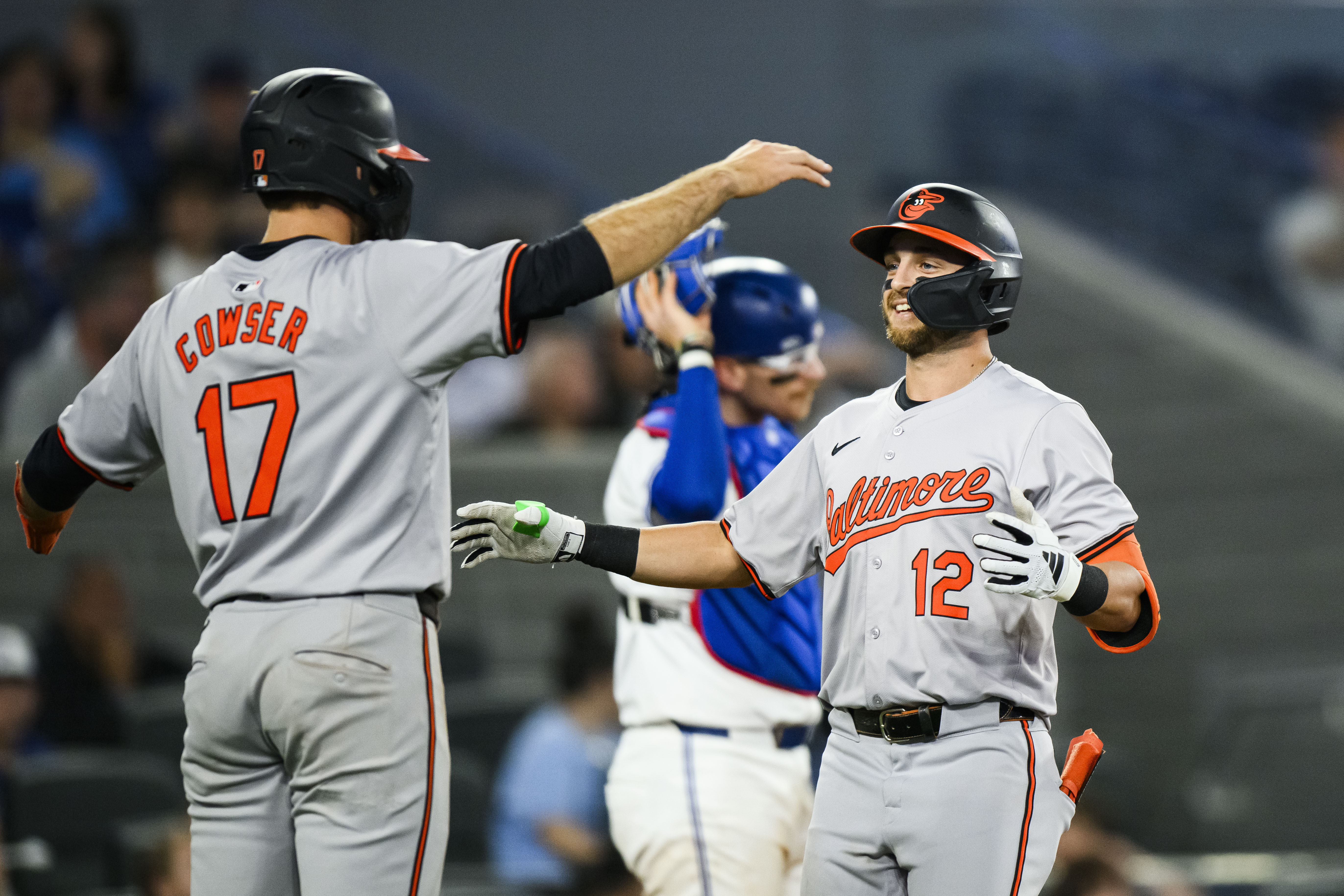 Baltimore Orioles' Connor Norby (12) celebrates with Colton Cowser (17) after hitting a two-run home run during the eighth inning of a baseball game against the Toronto Blue Jays Tuesday, June 4, 2024, in Toronto. (Christopher Katsarov/The Canadian Press via AP)