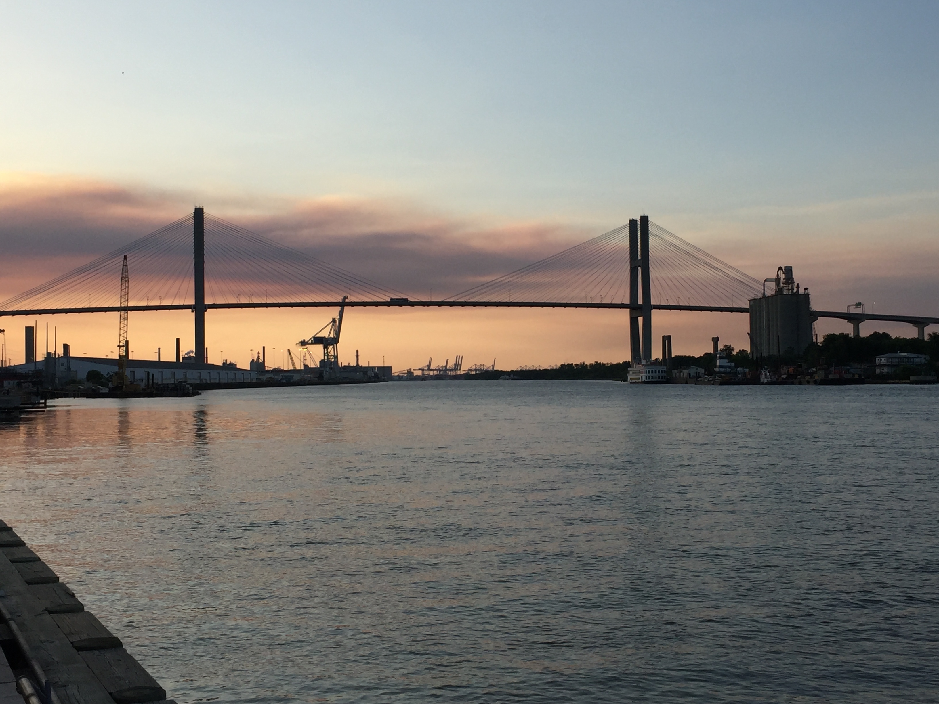 The Eugene Talmadge Memorial Bridge, pictured here in 2017, has 185 feet of vertical clearance, but local officials are considering increasing its height. In Maryland, officials will soon decide how tall to make the new Key Bridge.