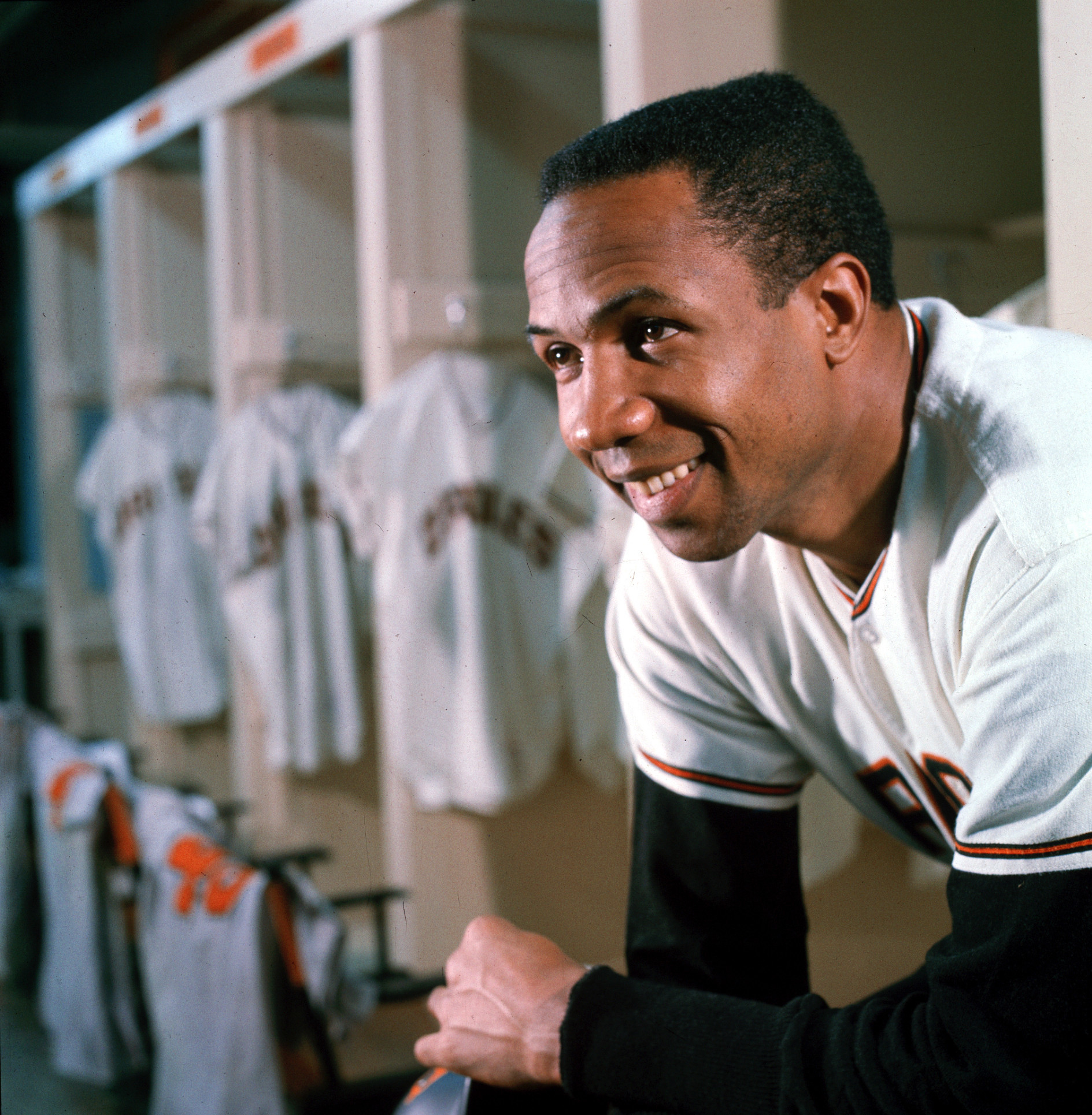 Frank Robinson poses in the Orioles clubhouse.