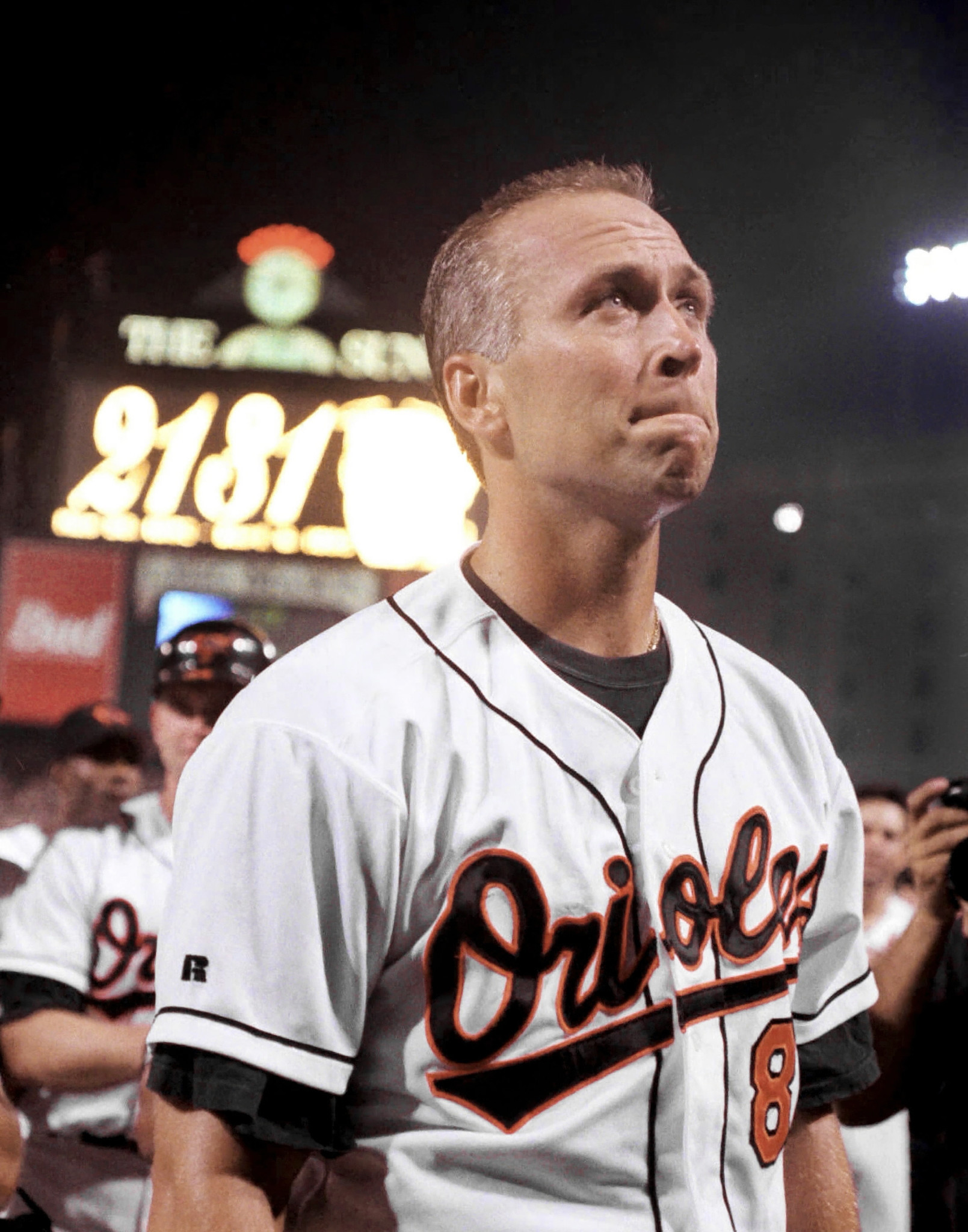 Cal Ripken Jr. bites his lip after his 2,131st consecutive game became official on Sept. 6, 1995, putting him past Lou Gehrig for the Major League Baseball record. (Karl Merton Ferron/Staff Photo)