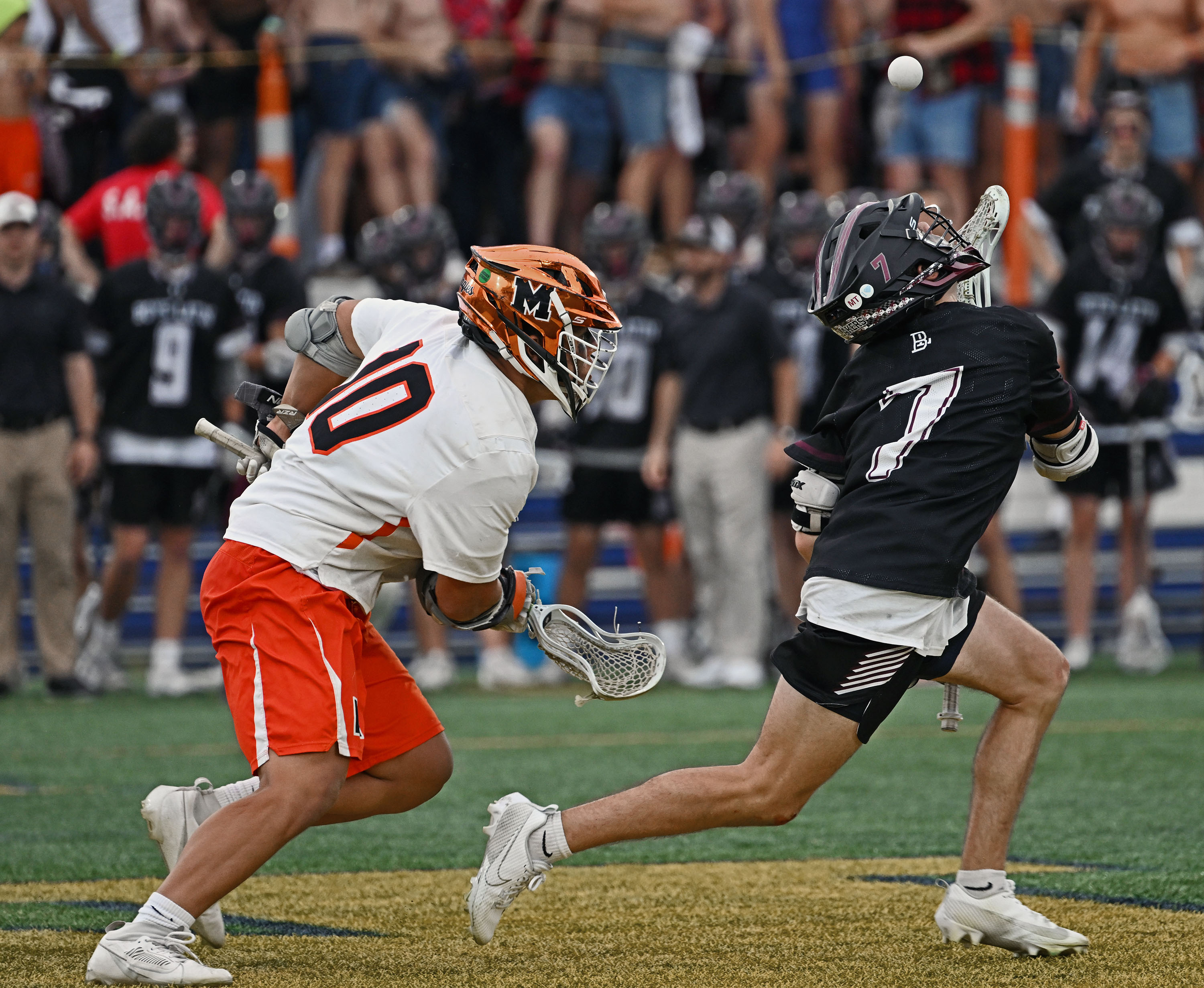 Boys' Latin's Parker Hoffman, right, looks to control the ball after facing off against Mconogh's Peyton Makowiecki, left, to start overtime. McDonogh defeated Boys' Latin 8-7 in MIAA A boys lacrosse semifinals at the Navy Marine Corps Memorial Stadium.May 16, 2023