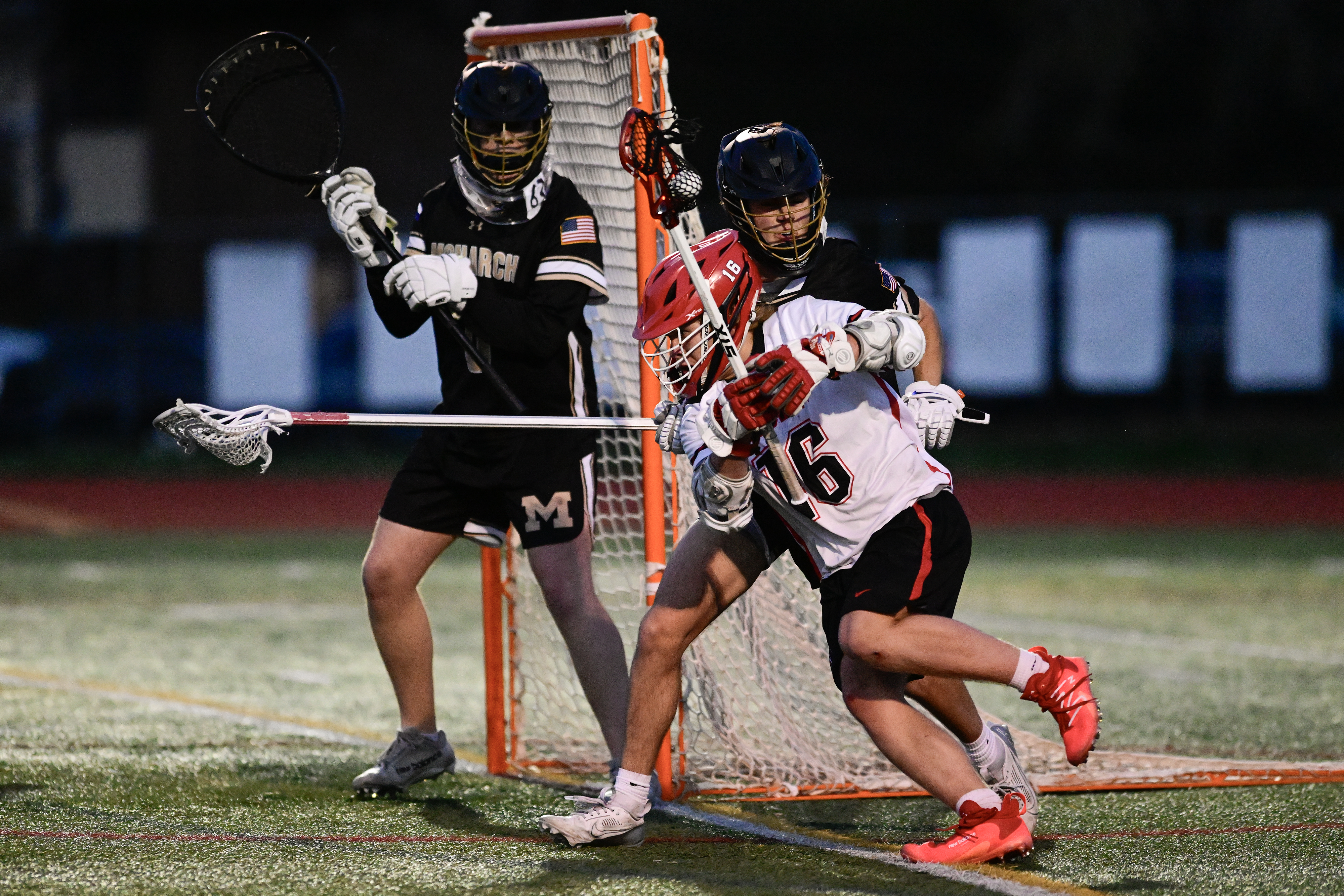 Fairview's Hook Dancy, center, tries to find an opening between Monarch's goalkeeper Mason Kish, left, and Thomas Perkins, right, in Boulder on Wednesday, April 24, 2024. (Matthew Jonas/Staff Photographer)