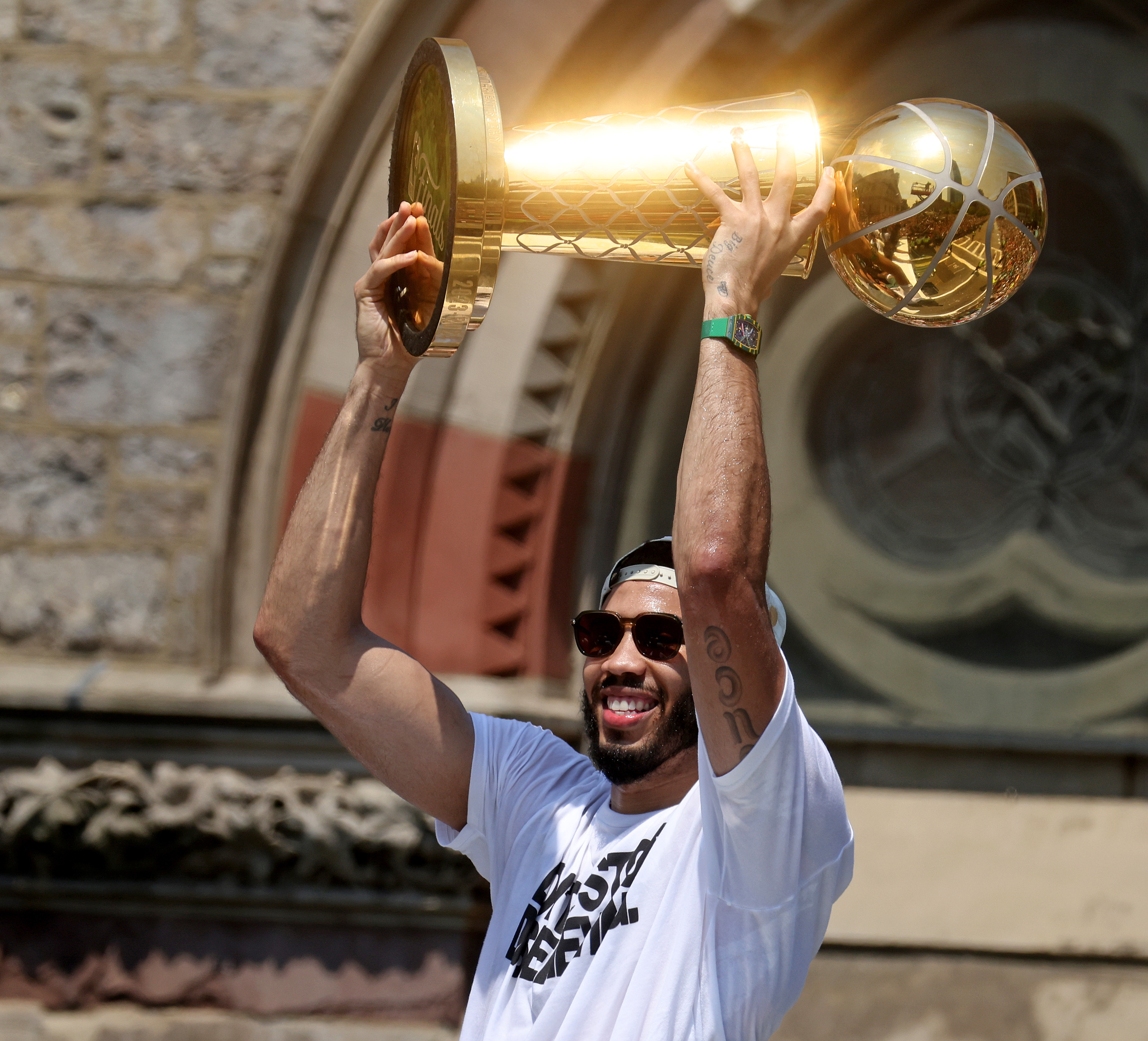 Jayson Tatum holds the championship trophy during the Boston Celtics Championship parade. (Photo By Matt Stone/Boston Herald)