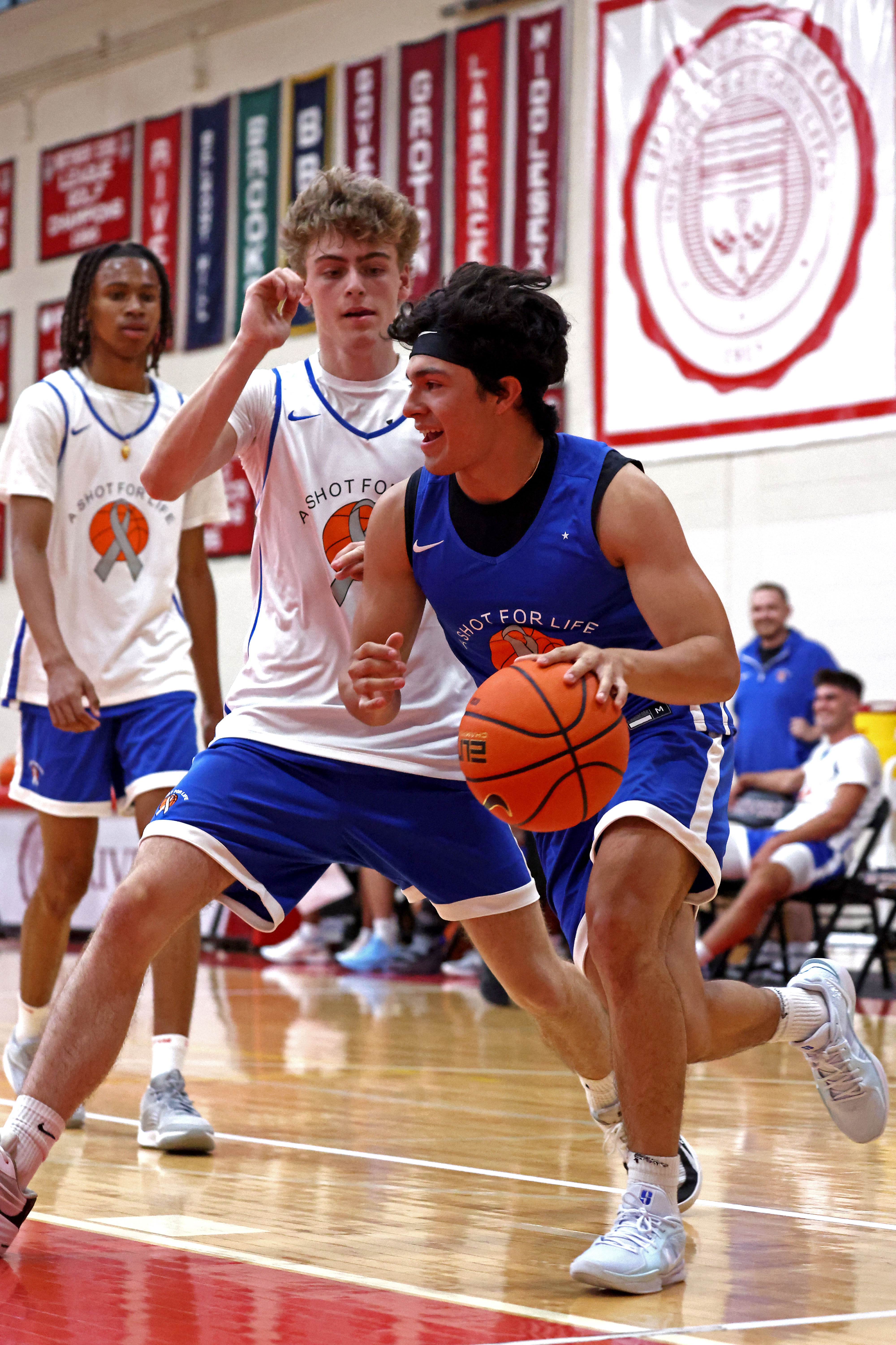 Diego Velez, right, drives around Drew Kahn at the boys A Shot For Life basketball game in Weston. (Staff Photo/Stuart Cahill/Boston Herald)