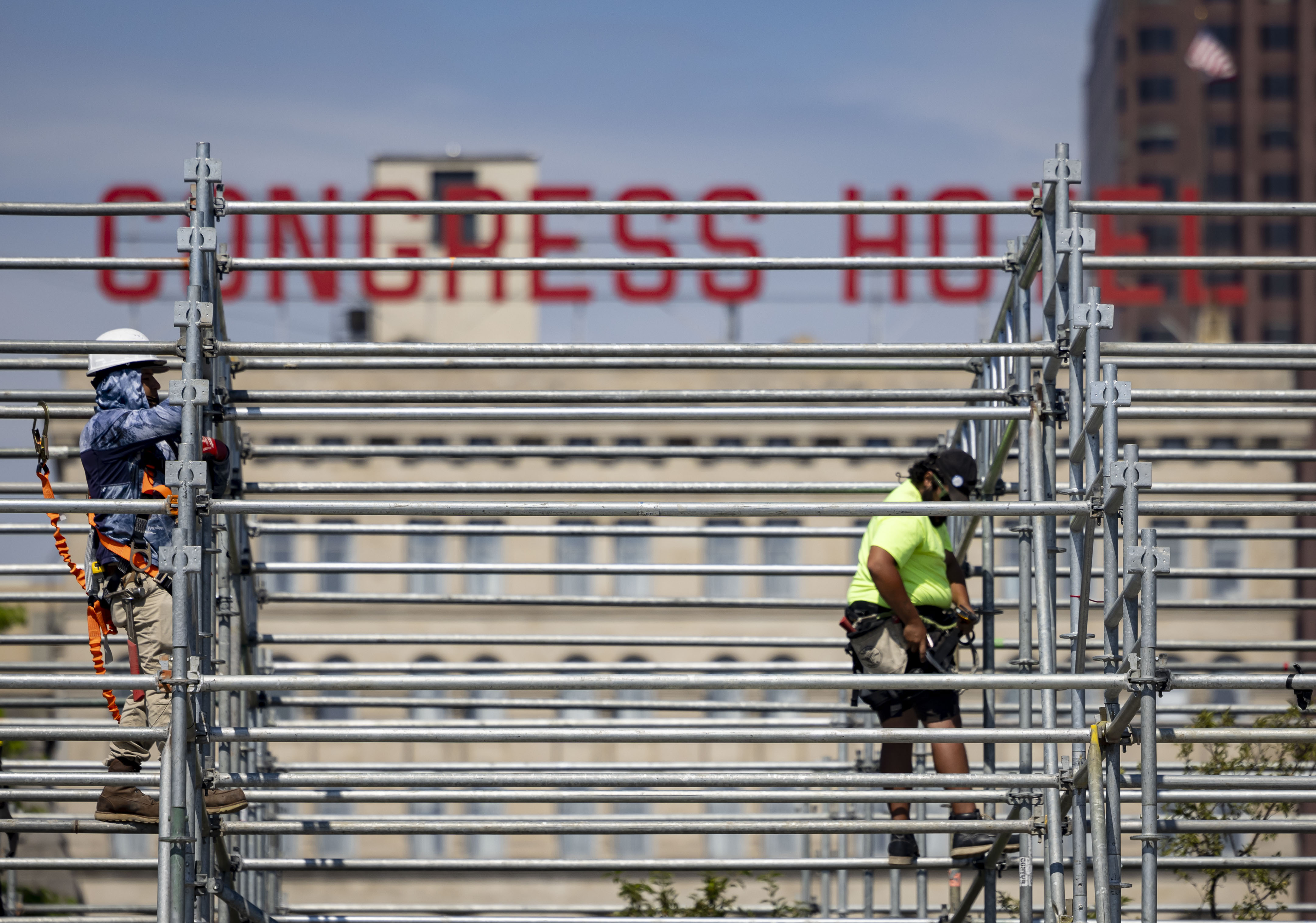 Workers construct a three-story grandstand which includes the Skyline premium hospitality club overlooking pit road and the start/finish line at Buckingham Fountain for the NASCAR Chicago Street Race on June 13, 2024, on Ida B. Wells Drive in Grant Park. (Brian Cassella/Chicago Tribune)