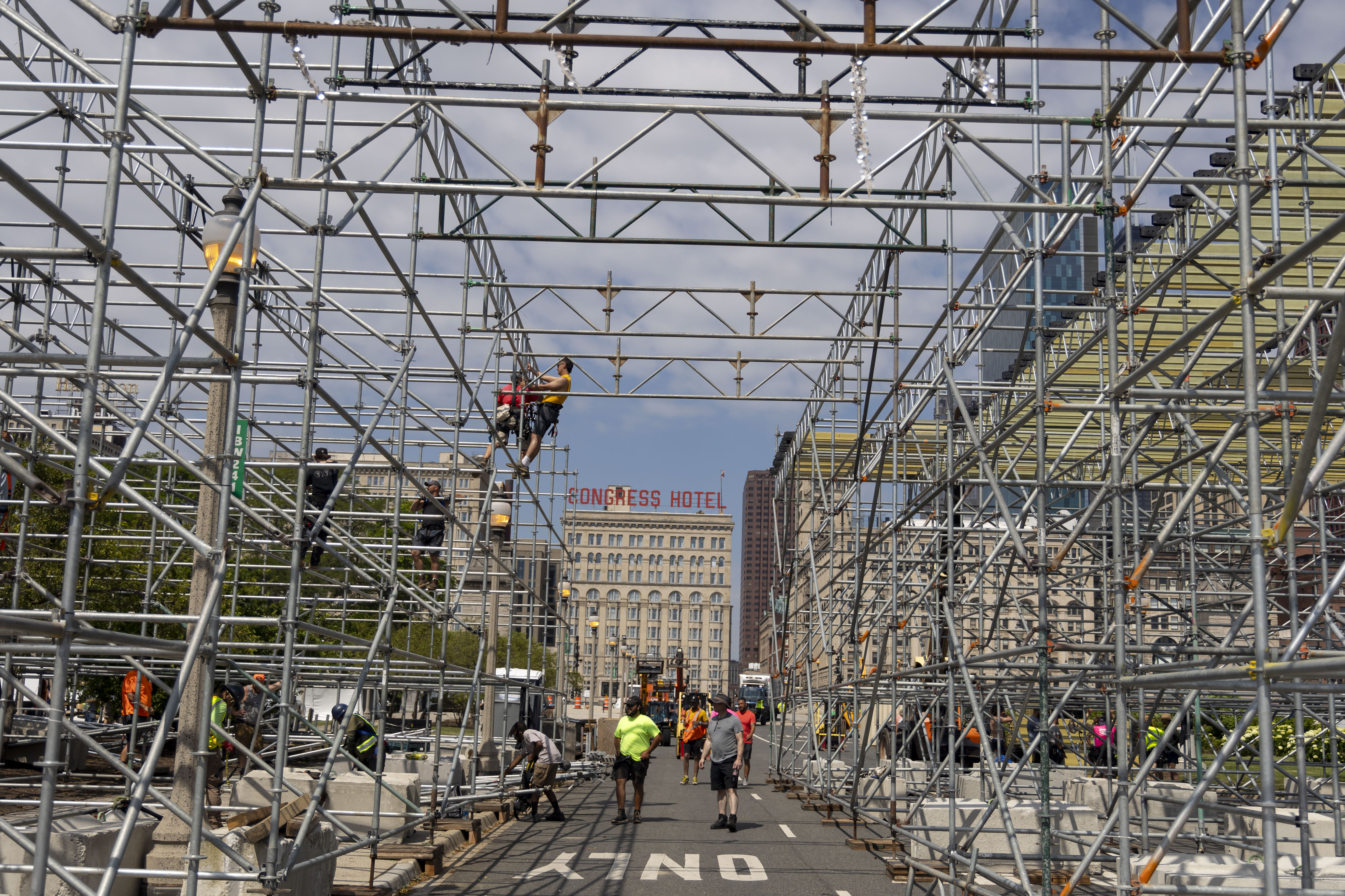 Workers construct a three-story grandstand which includes the Skyline premium hospitality club overlooking pit road and the start/finish line at Buckingham Fountain for the NASCAR Chicago Street Race on June 13, 2024, on Ida B. Wells Drive in Grant Park. (Brian Cassella/Chicago Tribune)
