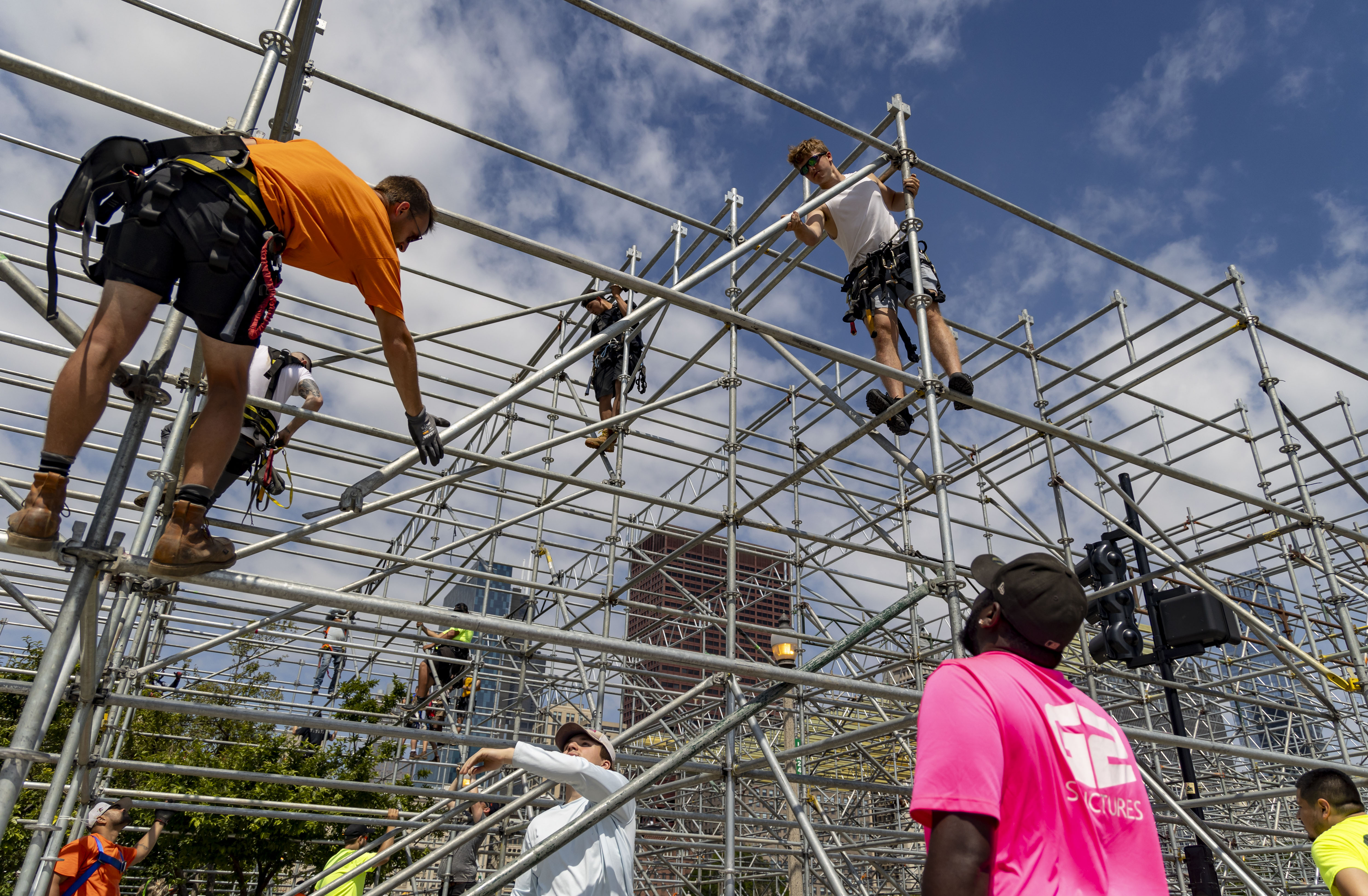 Workers construct a three-story grandstand which includes the Skyline premium hospitality club overlooking pit road and the start/finish line at Buckingham Fountain for the NASCAR Chicago Street Race on June 13, 2024, on Ida B. Wells Drive in Grant Park. (Brian Cassella/Chicago Tribune)