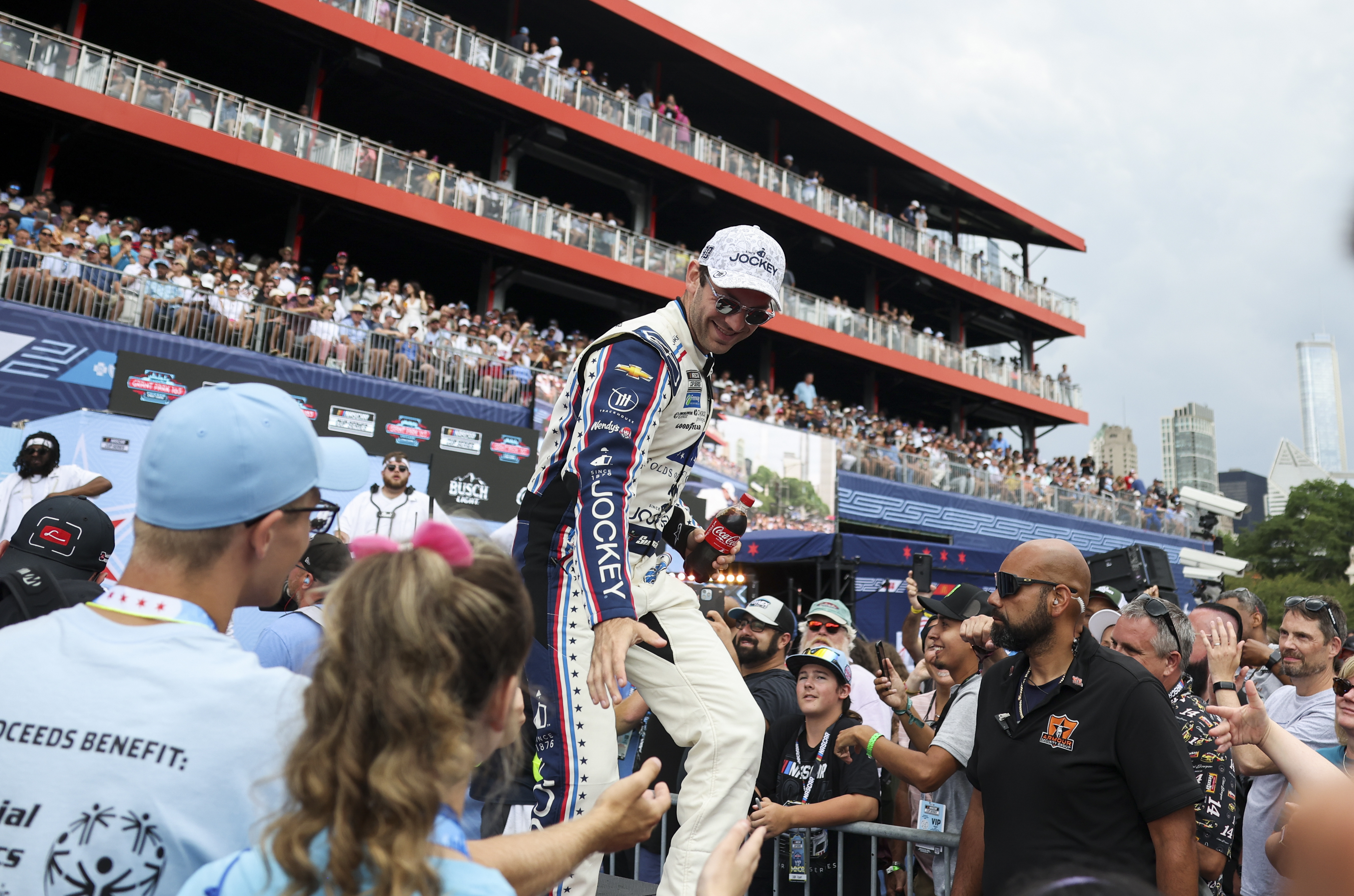 Daniel Suarez gets high-fives during introductions before the NASCAR Chicago Street Race in Grant Park on July 7, 2024. (Eileen T. Meslar/Chicago Tribune)