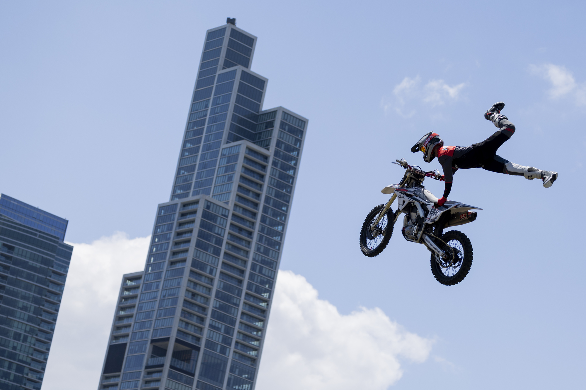 A stunt dirt bike rider performs during the Monster FMX Show during the first day of the NASCAR Street Race on Saturday, July 6, 2024, at Grant Park in Chicago (Vincent Alban/Chicago Tribune)