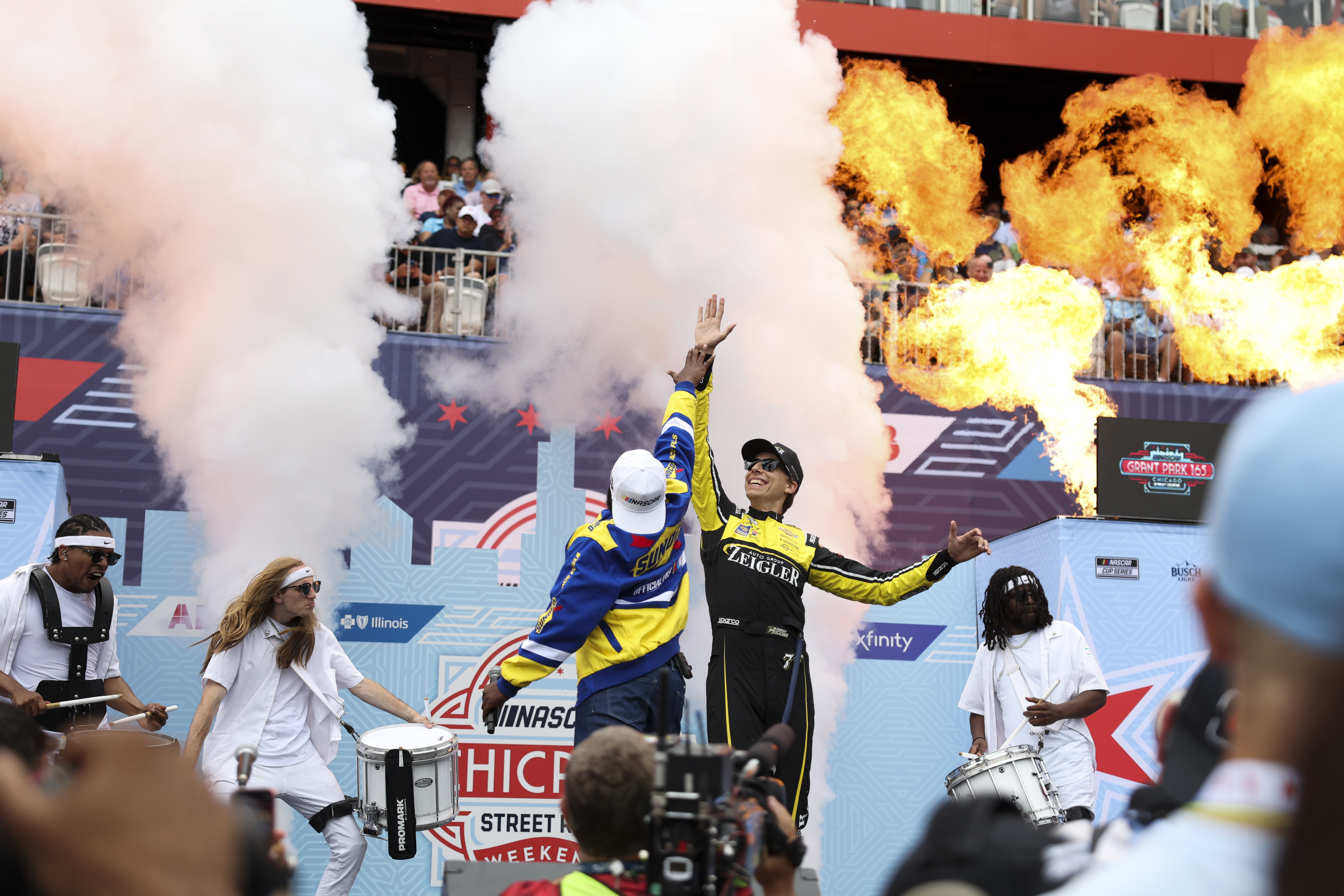 Driver Carson Hocevar gets a high-five during his introduction at the NASCAR Chicago Street Race in Grant Park on July 7, 2024. (Eileen T. Meslar/Chicago Tribune)