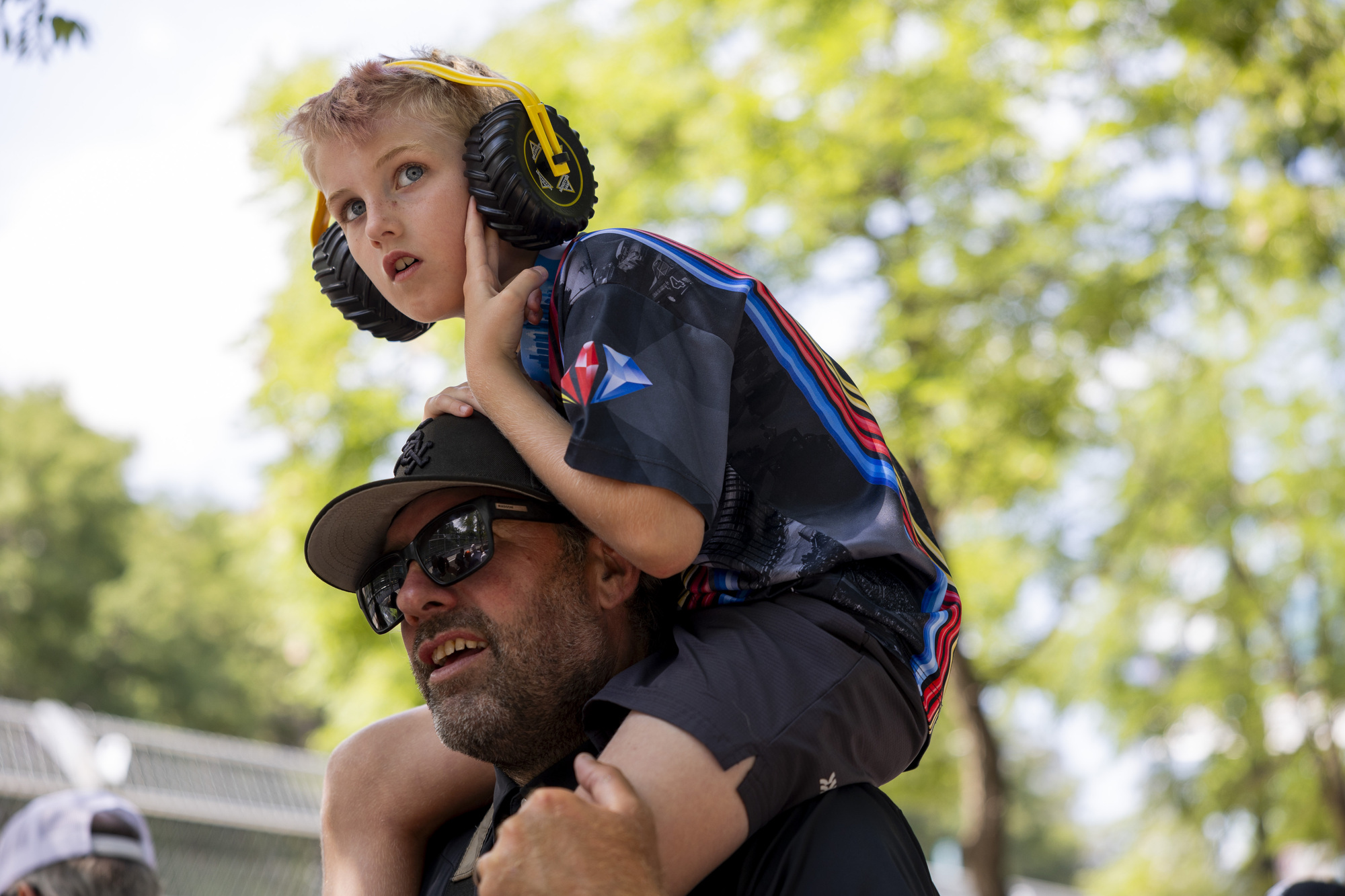 Jackson Cronin sits on the shoulders of his father Jake Cronin while watching the Xfinity Series during the first day of the NASCAR Street Race on Saturday, July 6, 2024, at Grant Park in Chicago (Vincent Alban/Chicago Tribune)