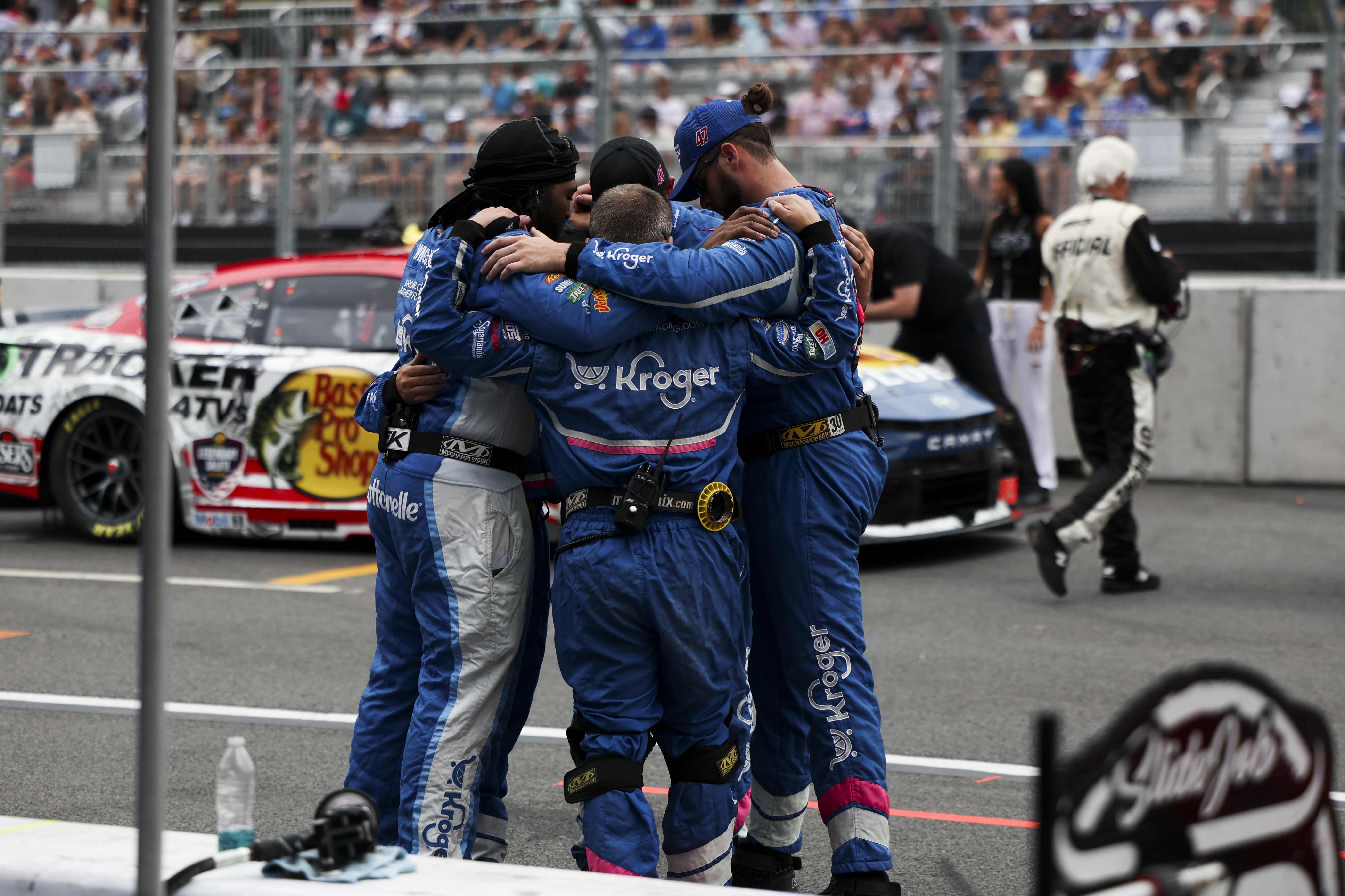 The pit crew for Ricky Stenhouse Jr. huddle up before the NASCAR Chicago Street Race in Grant Park on July 7, 2024. (Eileen T. Meslar/Chicago Tribune)