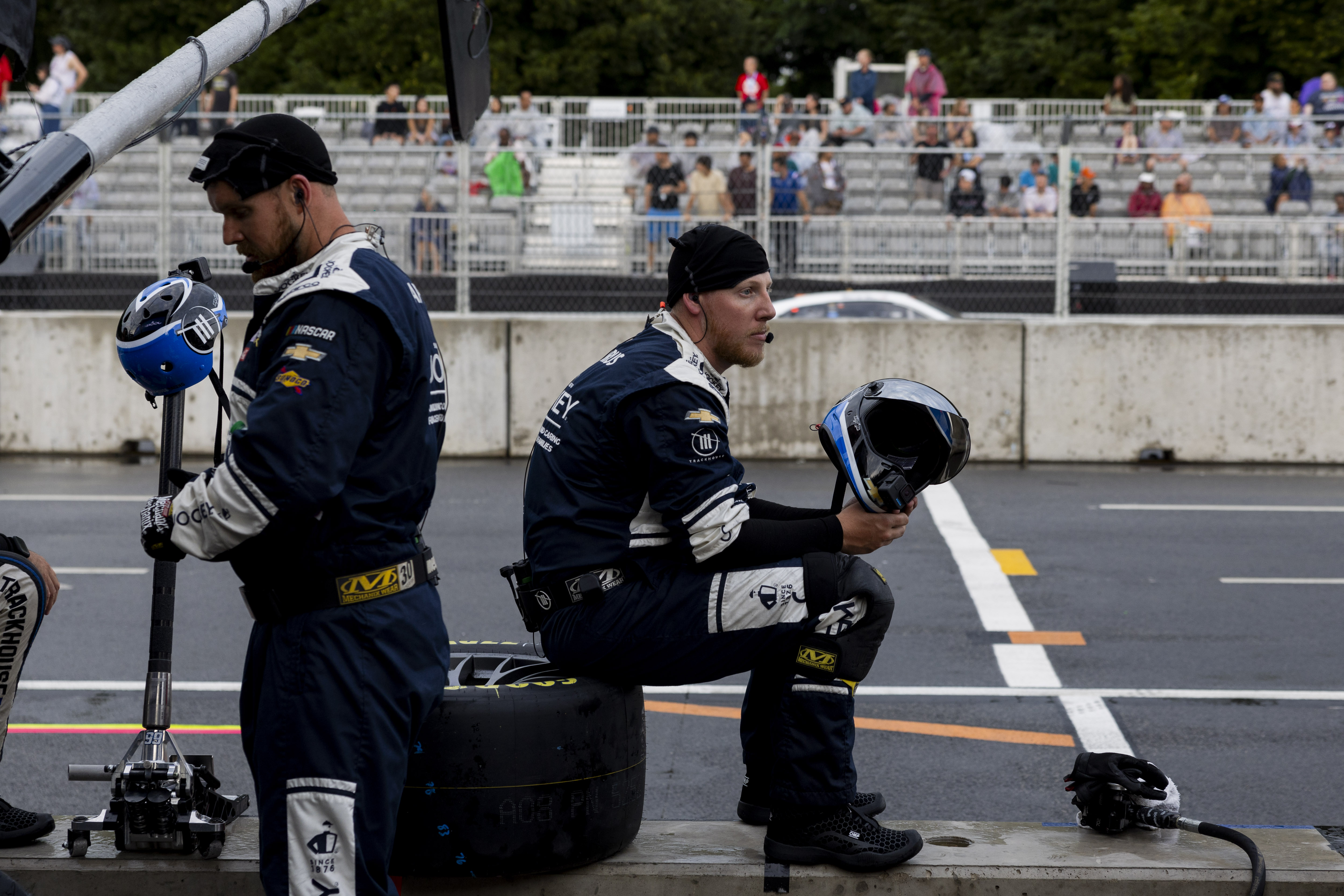 Pit crew members stand by during the Grant Park 165 of the NASCAR Street Race on Sunday, July 7, 2024, at Grant Park in Chicago. (Vincent Alban/Chicago Tribune)