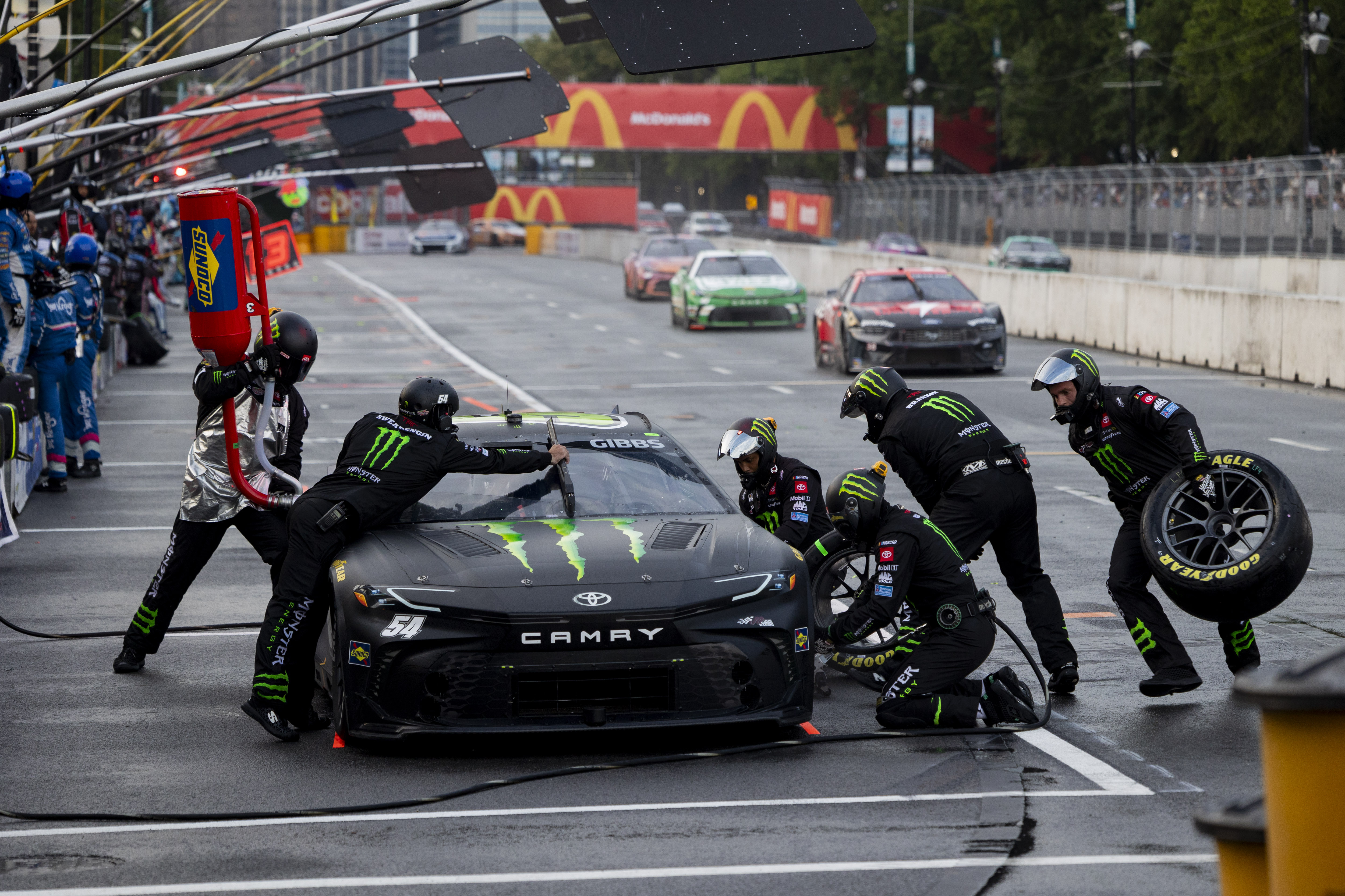 Pit crew members work on the car of Ty Gibbs #54 during the Grant Park 165 of the NASCAR Street Race on Sunday, July 7, 2024, at Grant Park in Chicago. (Vincent Alban/Chicago Tribune)