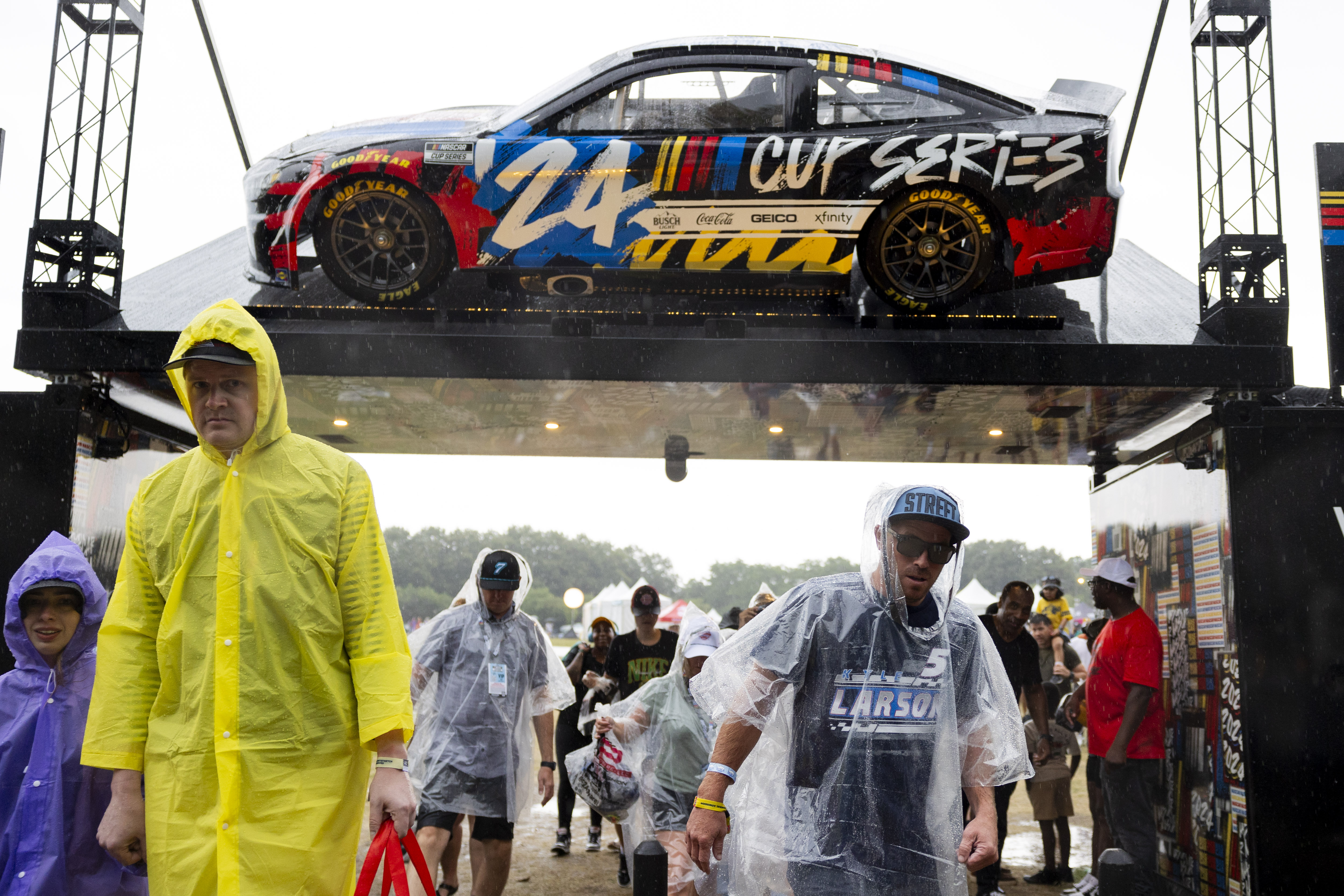 Fans leave during a rain delay during the second day of the NASCAR Street Race on Sunday, July 7, 2024, at Grant Park in Chicago. (Vincent Alban/Chicago Tribune)