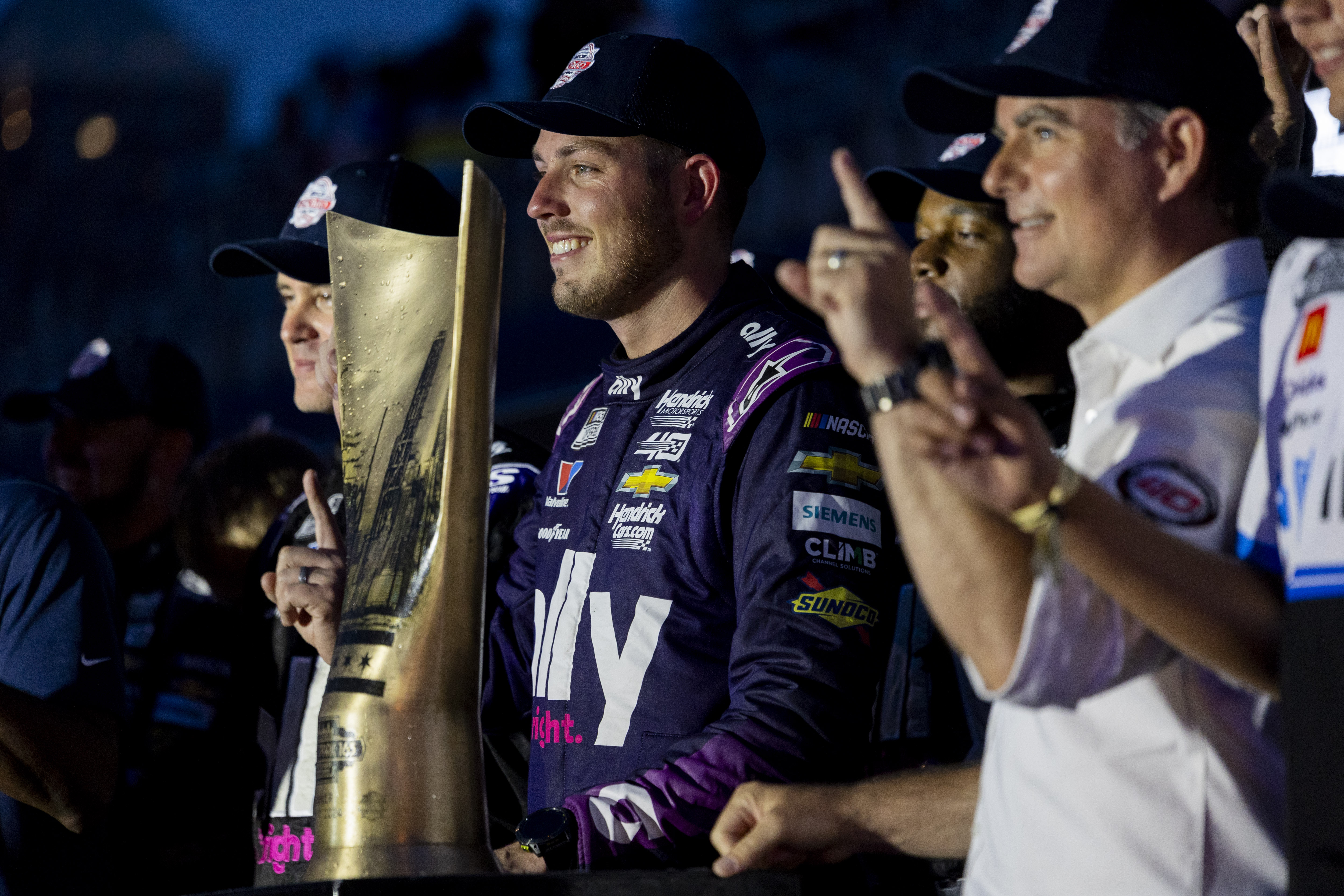 Alex Bowman #48 poses for a photo with his teammates after winning the Grant Park 165 of the NASCAR Street Race on Sunday, July 7, 2024, at Grant Park in Chicago. (Vincent Alban/Chicago Tribune)