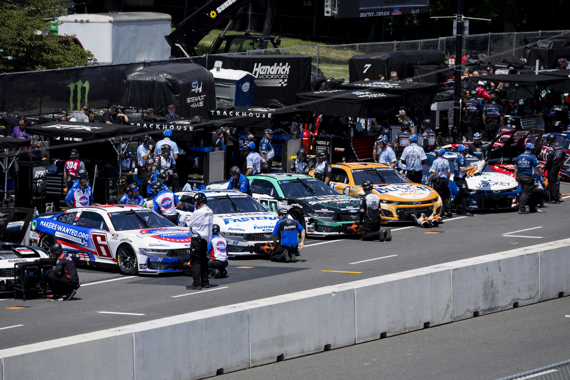 Pit crews work on their cars during the first day of the NASCAR Street Race, July 6, 2024, at Grant Park in Chicago (Vincent Alban/Chicago Tribune)