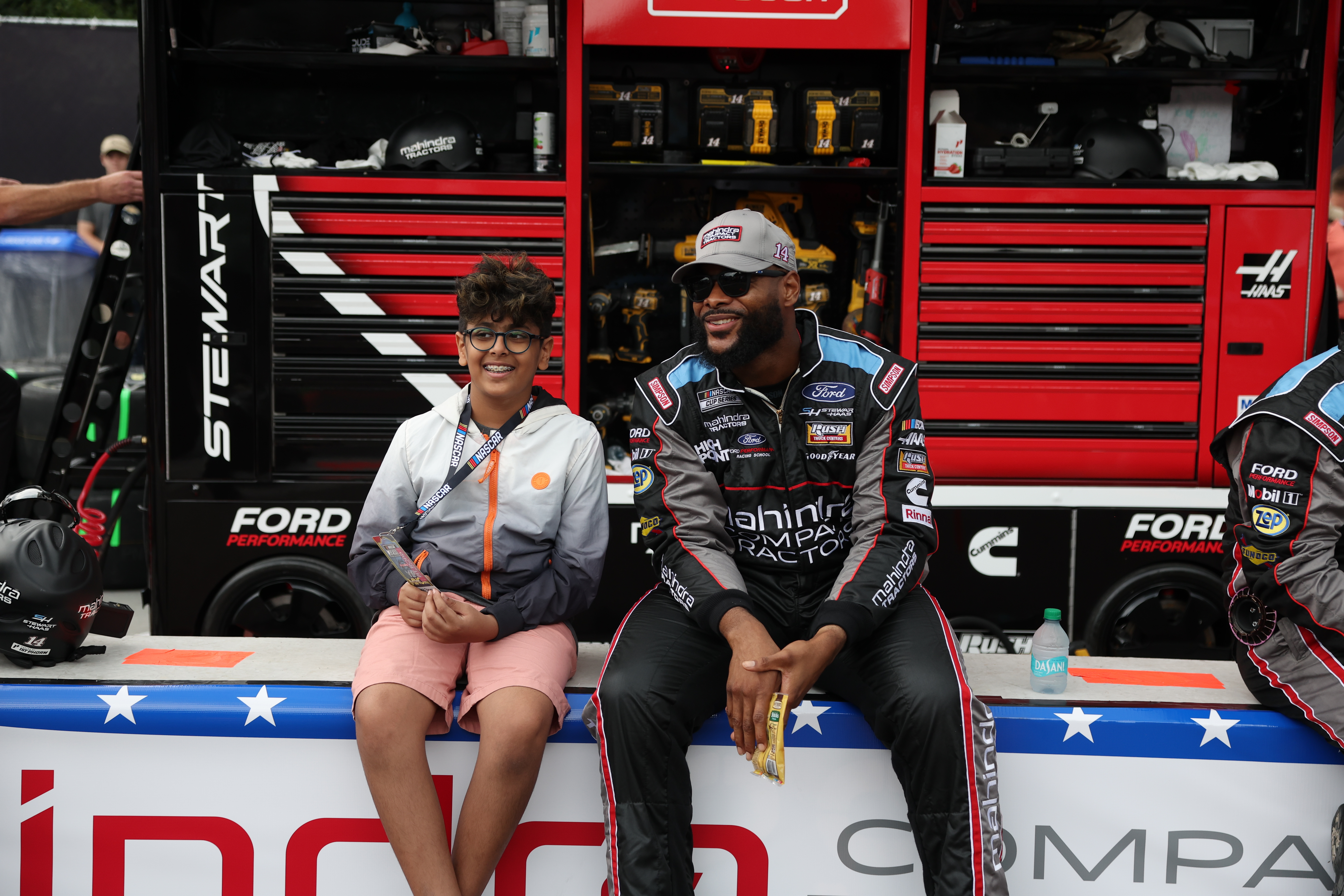 Kapil Fletcher, a pit crew member of Chase Briscoe (#14), speaks to a fan, Angad Bhargava, before the race. (Eileen T. Meslar/Chicago Tribune)