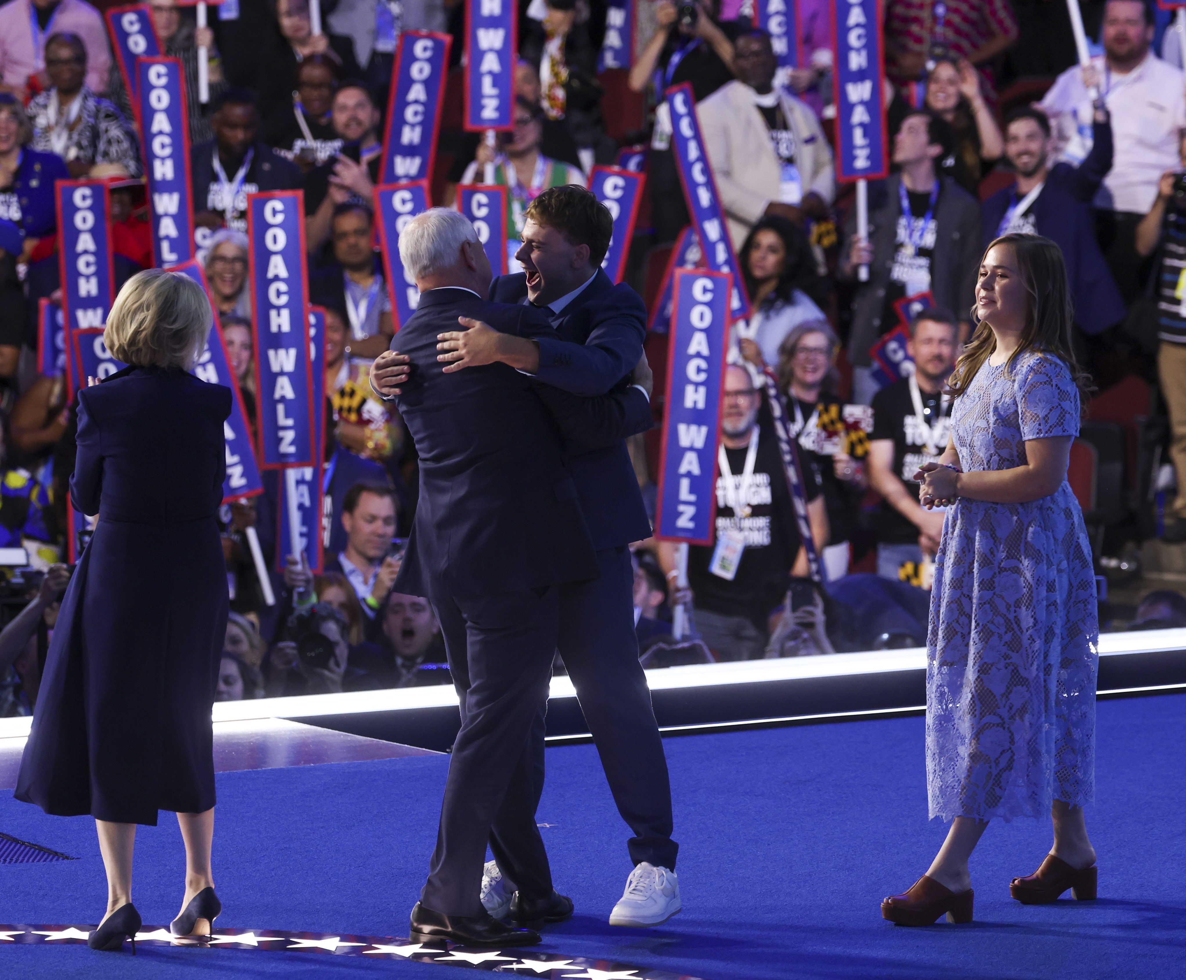 Democratic vice presidential nominee Minnesota Gov. Tim Walz is joined on stage by his wife Gwen Walz, children Gus and Hope after his speech at the Democratic National Convention at the United Center in Chicago on Aug. 21, 2024. (Eileen T. Meslar/Chicago Tribune)