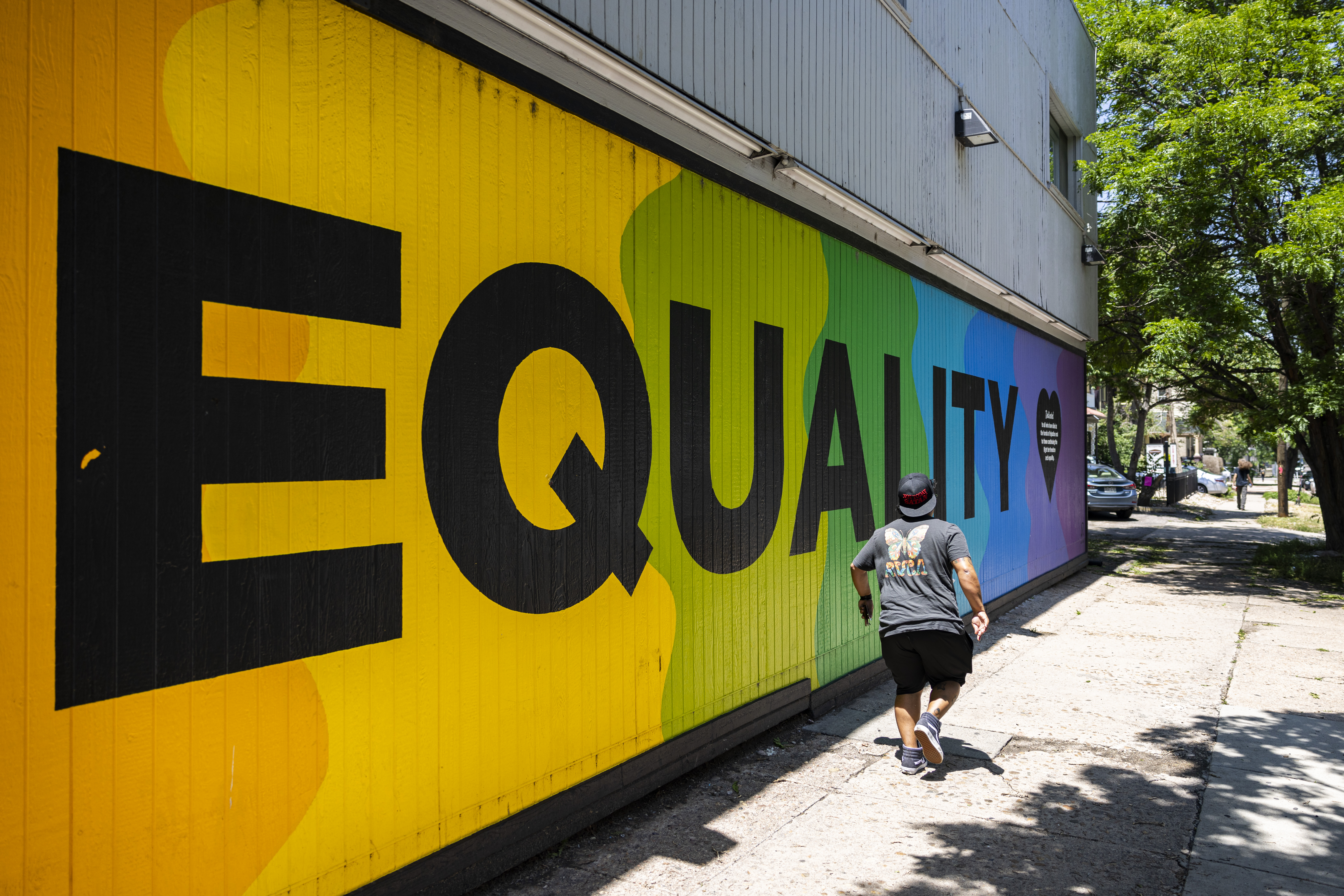 The X Bar and Romantix mural on East Colfax Avenue on Friday, June 23, 2023. Members from the Center on Colfax, Black Pride Colorado, and the Colfax Ave Business Improvement District are coming together to create Colorado's first queer cultural district, called Lavender Hill. (Photo by Grace Smith/The Denver Post)