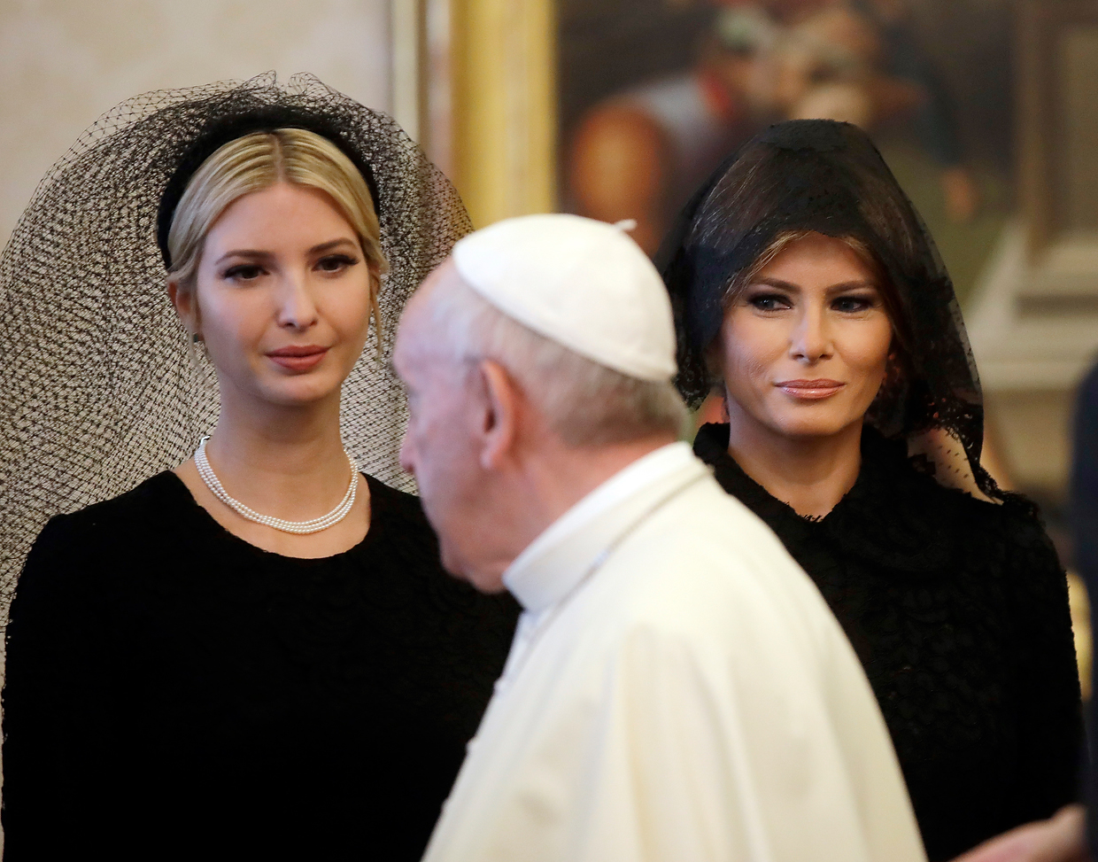 Pope Francis (C) walks past US First Lady Melania Trump (R) and the daughter of US President Donald Trump Ivanka Trump (L) at the end of a private audience at the Vatican on May 24, 2017. (ALESSANDRA TARANTINO/AFP/Getty Images)