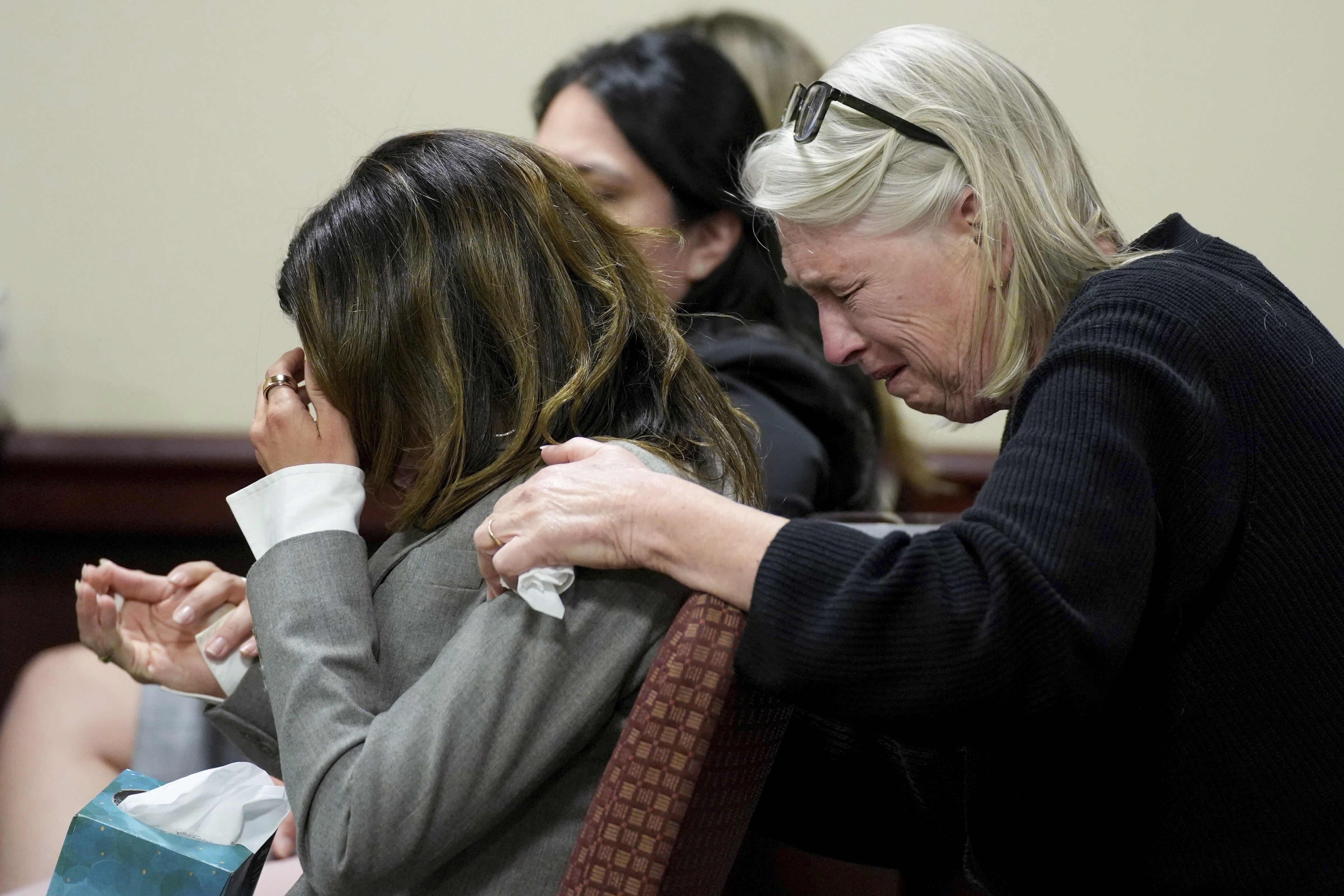 Hilaria Baldwin, left, wife of actor Alec Baldwin, and his sister Elizabeth Keuchler react during Alec Baldwin's trial for involuntary manslaughter for the 2021 fatal shooting of cinematographer Halyna Hutchins during filming of the Western movie "Rust," Friday, July 12, 2024, at Santa Fe County District Court in Santa Fe, N.M